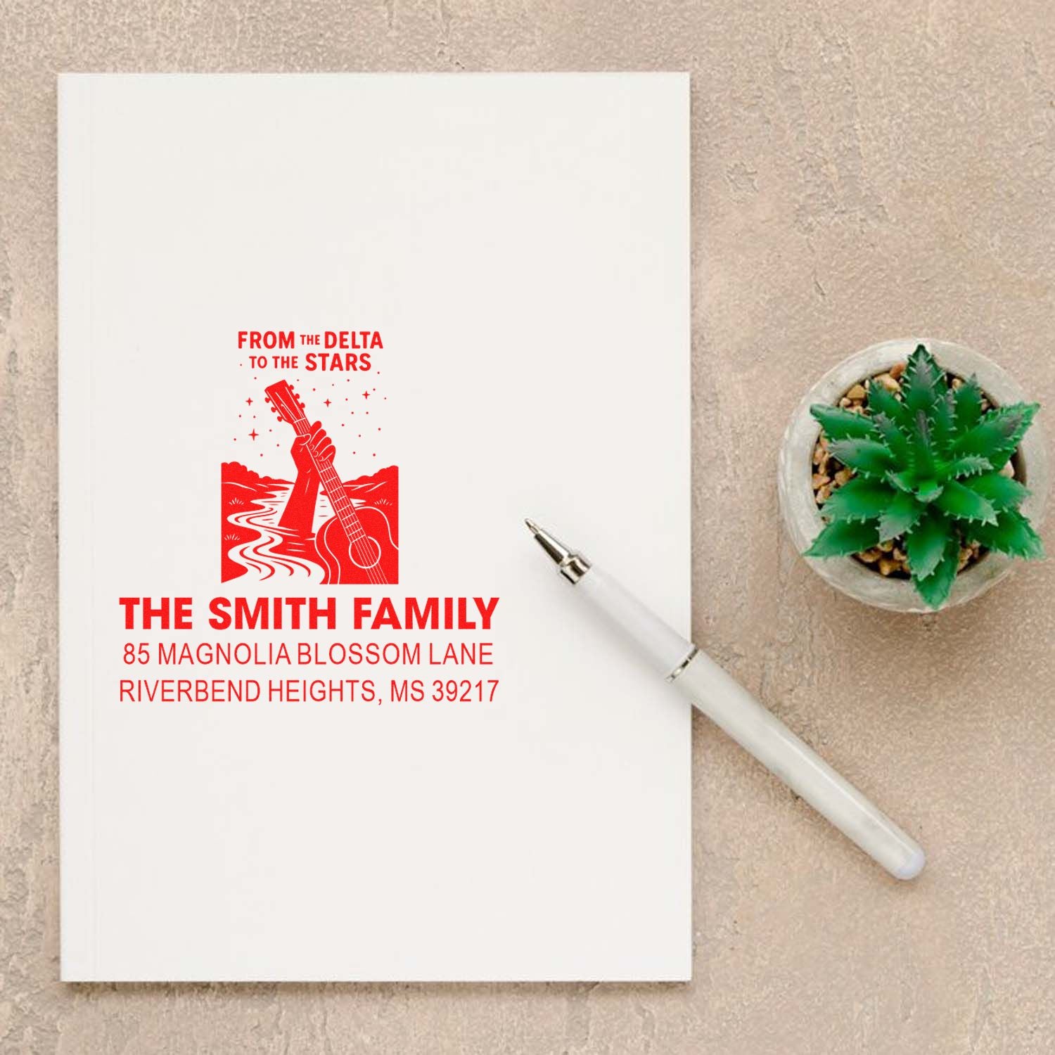 Custom return address rubber stamp with guitar artwork and From the Delta to the Stars family address design.