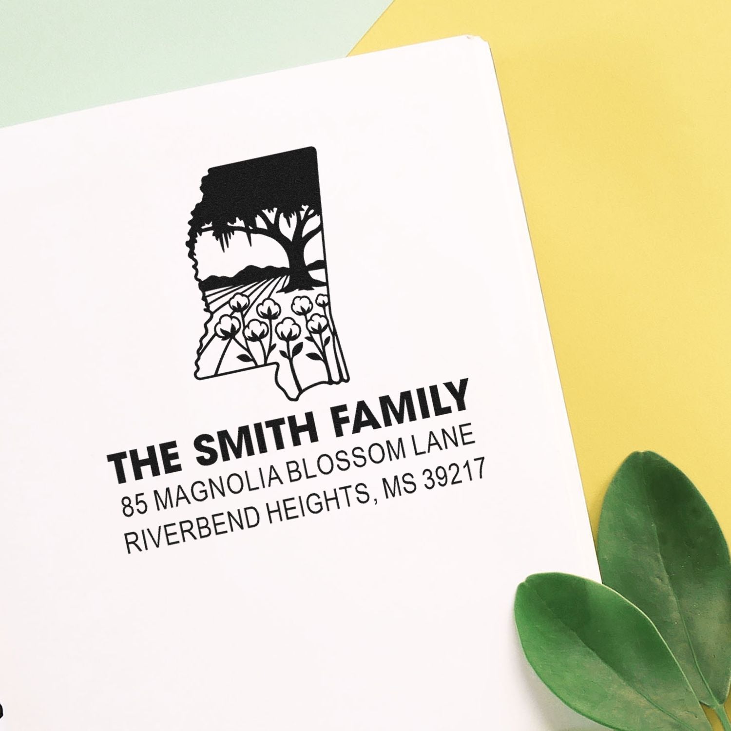 Custom rubber address stamp with Mississippi floral state design for The Smith Family envelopes