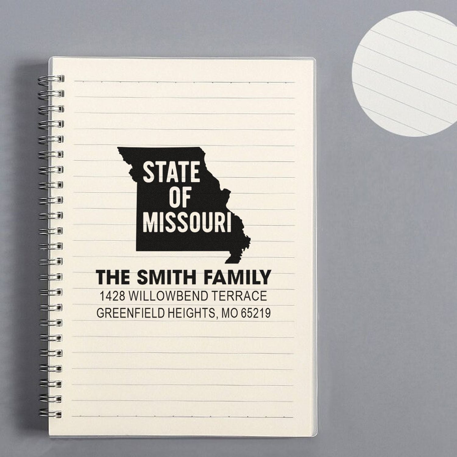 Custom Missouri return address rubber stamp with family name and address for personalized mail and stationery.