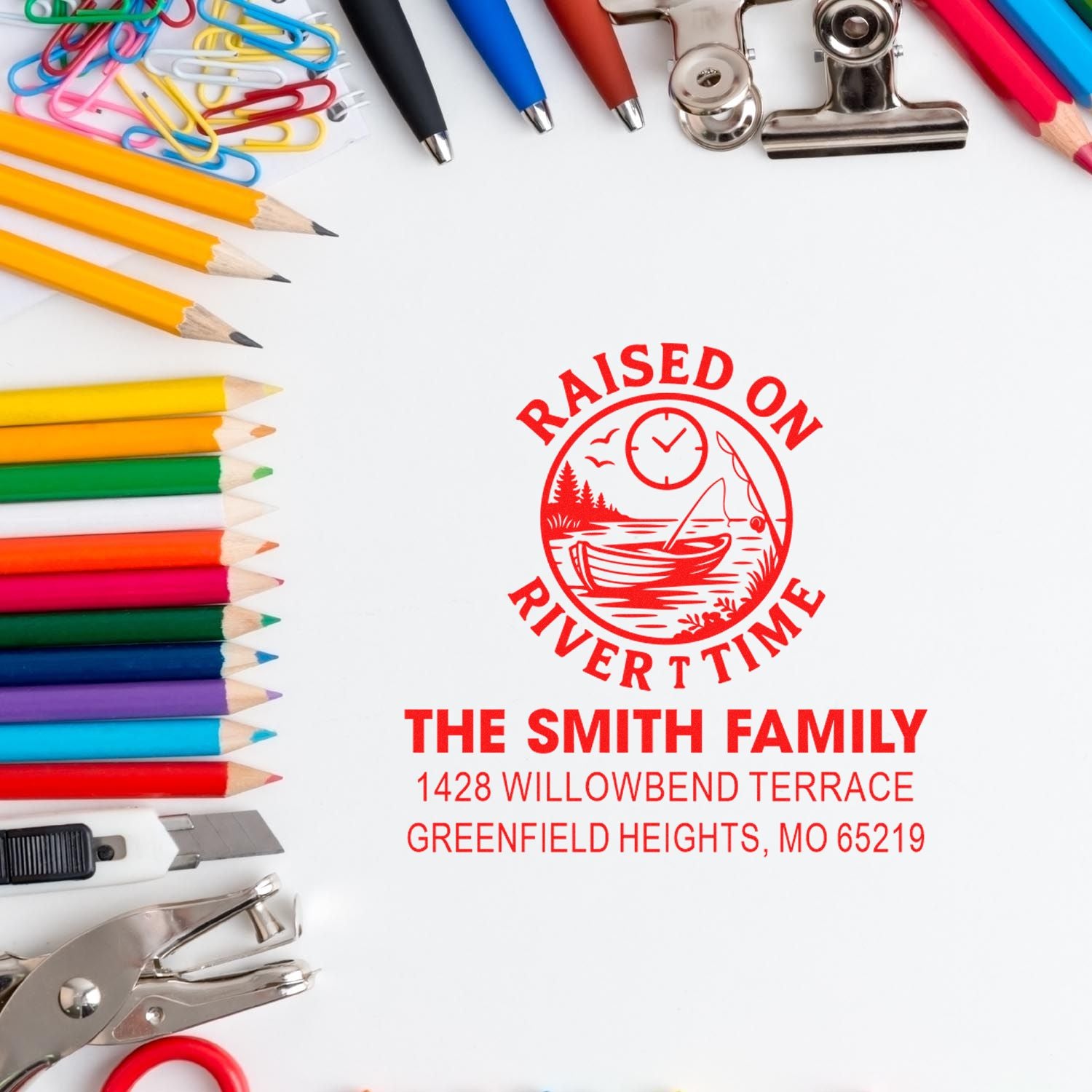 Custom rubber return address stamp for The Smith Family with Raised on River Time design, framed by stationery supplies.