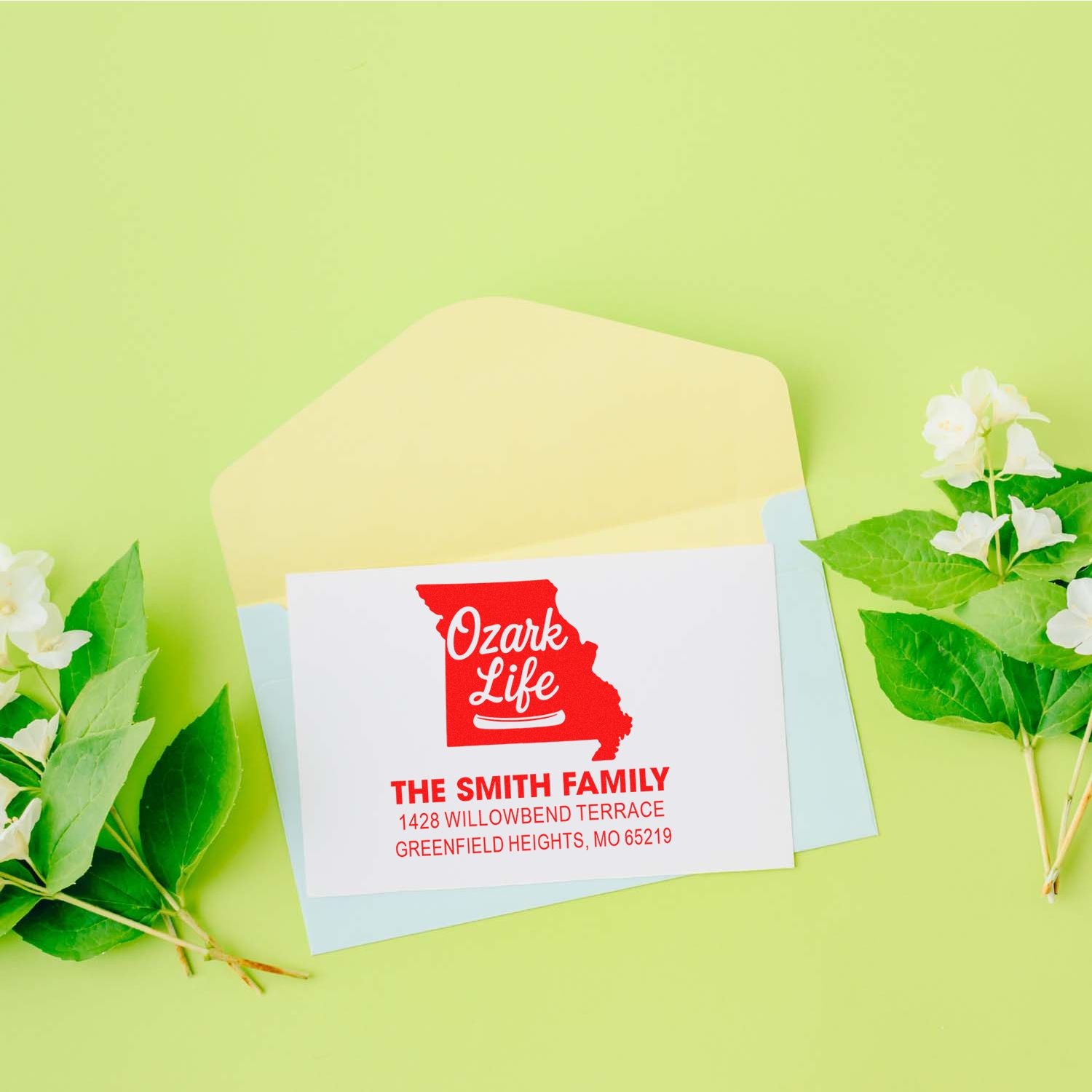 Custom rubber address stamp with Missouri design for The Smith Family, featuring Ozark Life return address on envelopes.