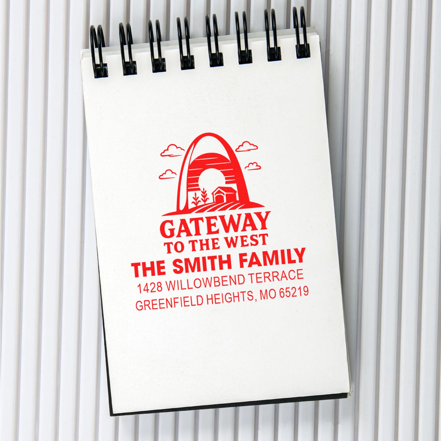 Custom return address rubber stamp for The Smith Family, featuring Gateway to the West design and Greenfield Heights, MO address.