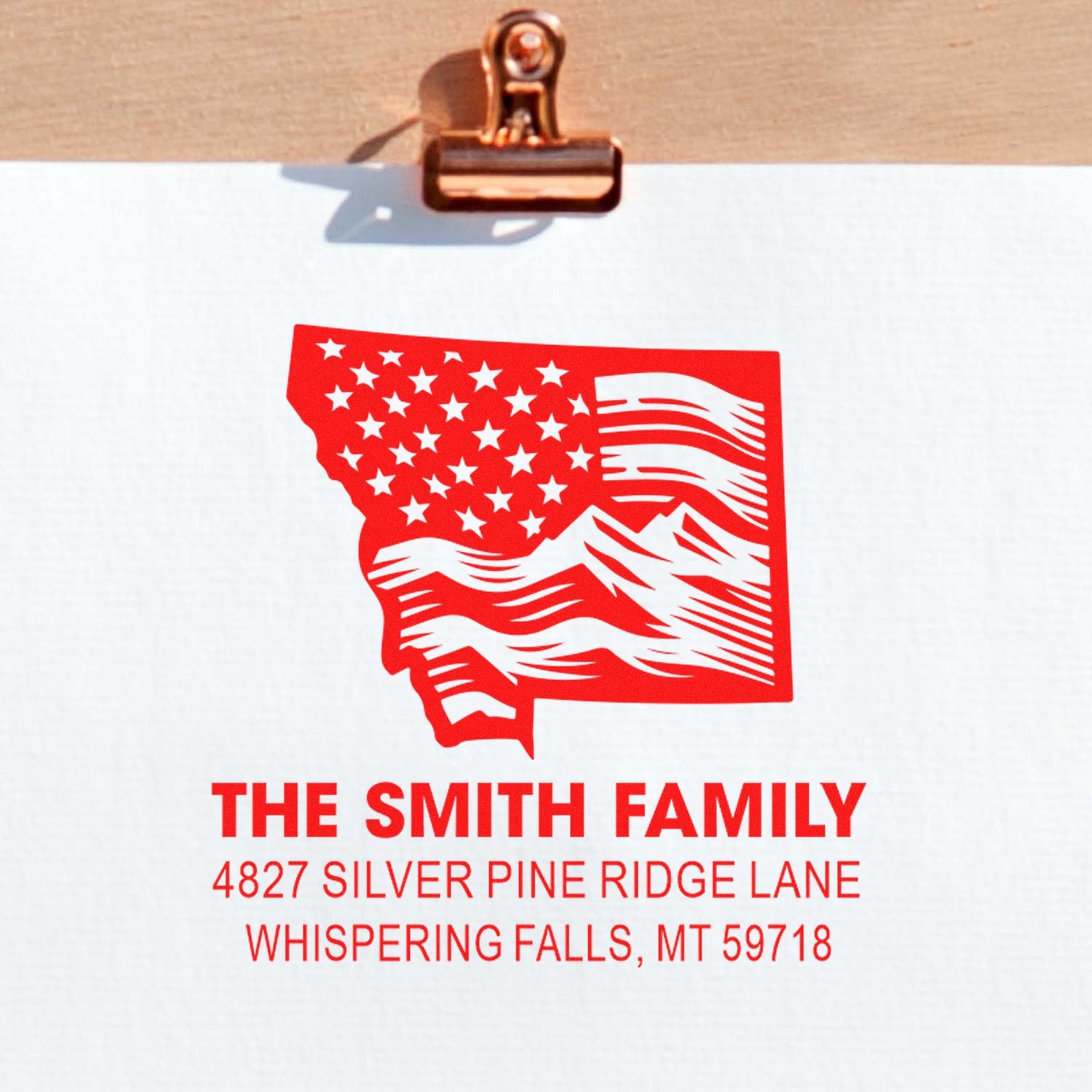 Custom family return address rubber stamp with Montana state flag design, name, street address, city and ZIP.