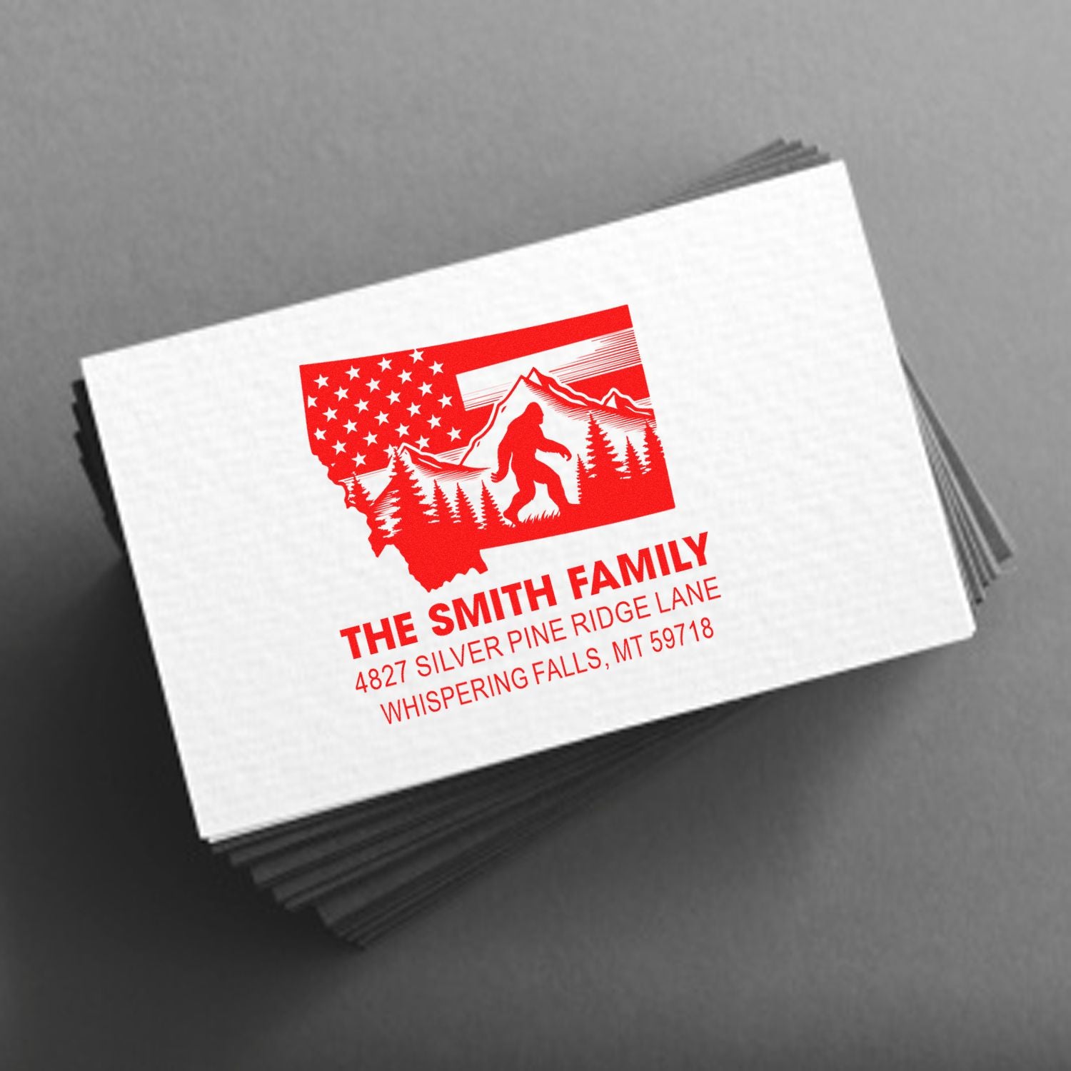 Custom rubber stamp design with Montana Bigfoot, mountains, and family address for personalized return address stamping.