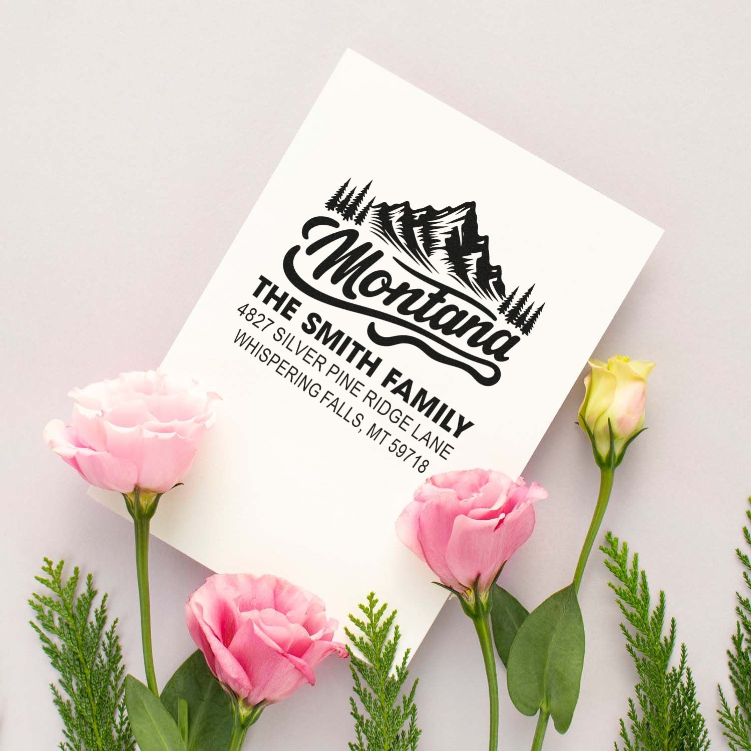 Custom rubber address stamp with mountain design for the Smith family, featuring name and Whispering Falls, MT return address.