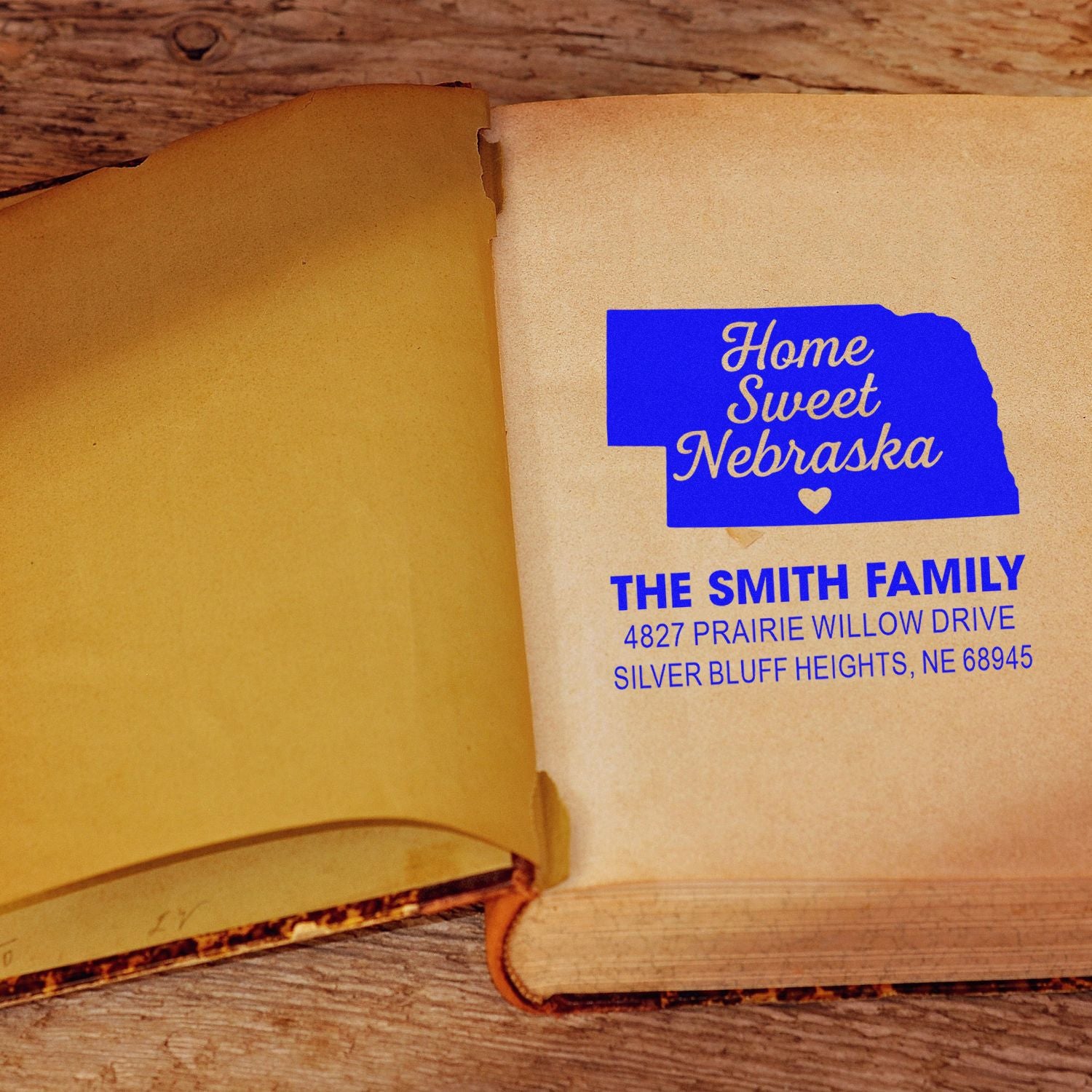 Custom Nebraska rubber address stamp on an envelope, featuring Home Sweet Nebraska for family mail and personalized stationery.