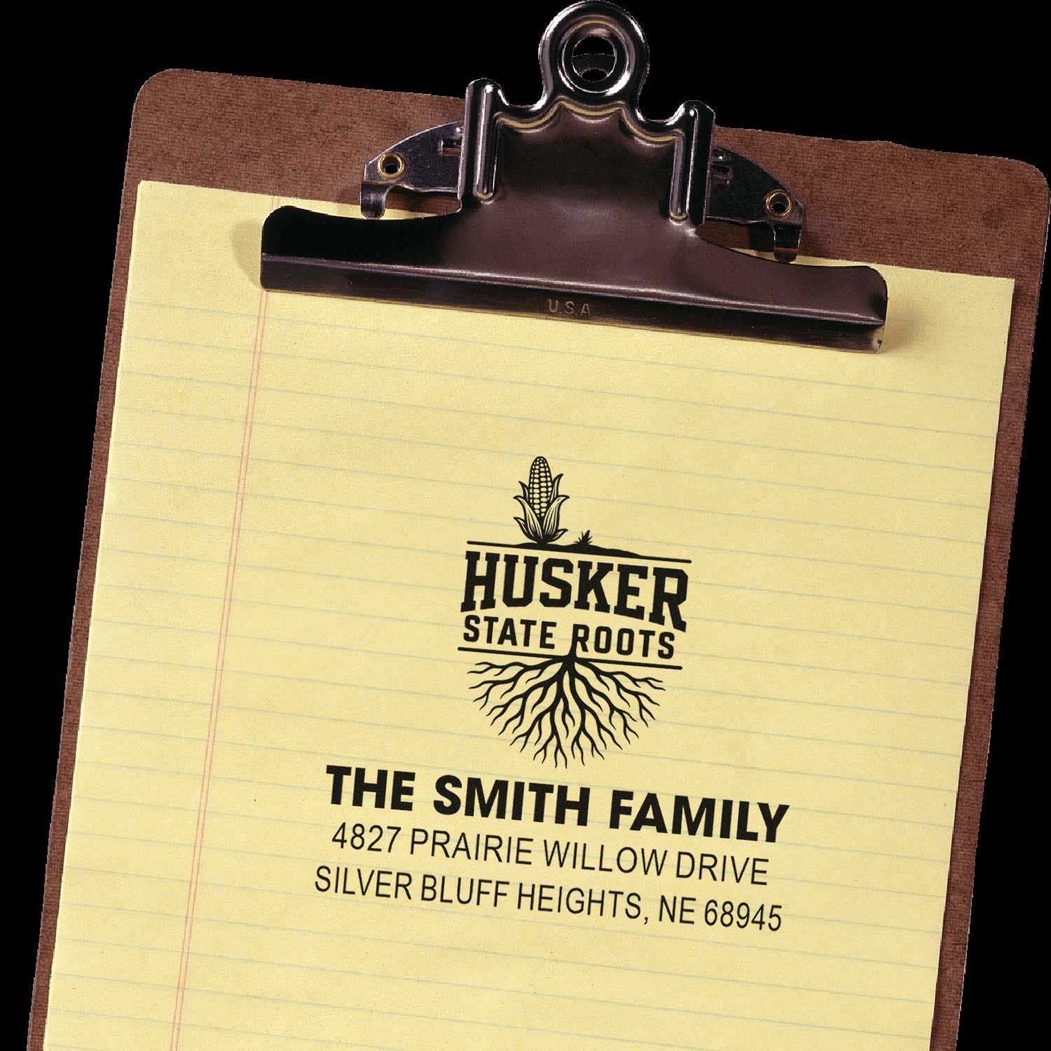 Custom Husker State Roots family address rubber stamp on clipboard, with The Smith Family and Nebraska mailing address.