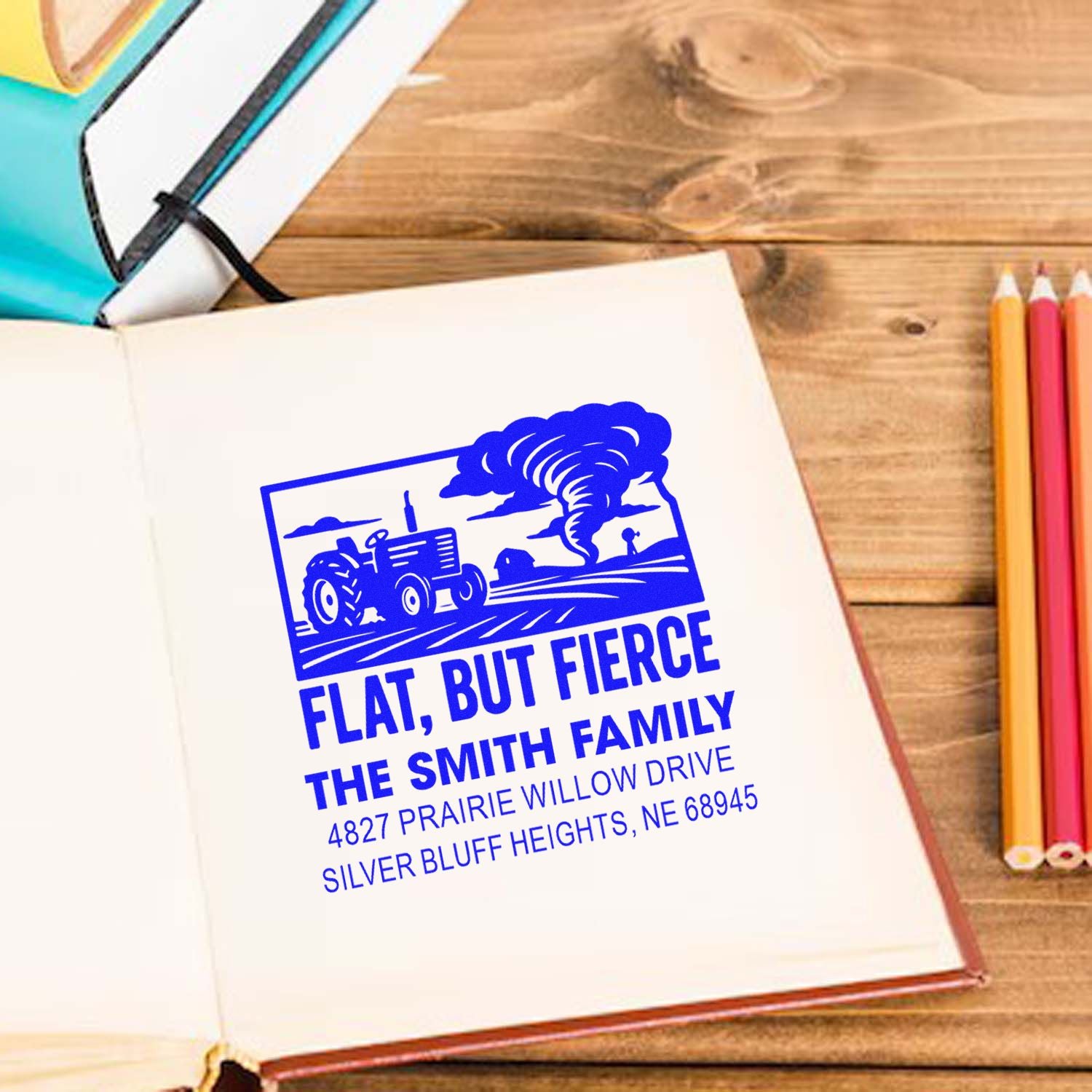 Custom rubber stamp design with tractor and tornado, personalized Flat, But Fierce farm address for The Smith Family.