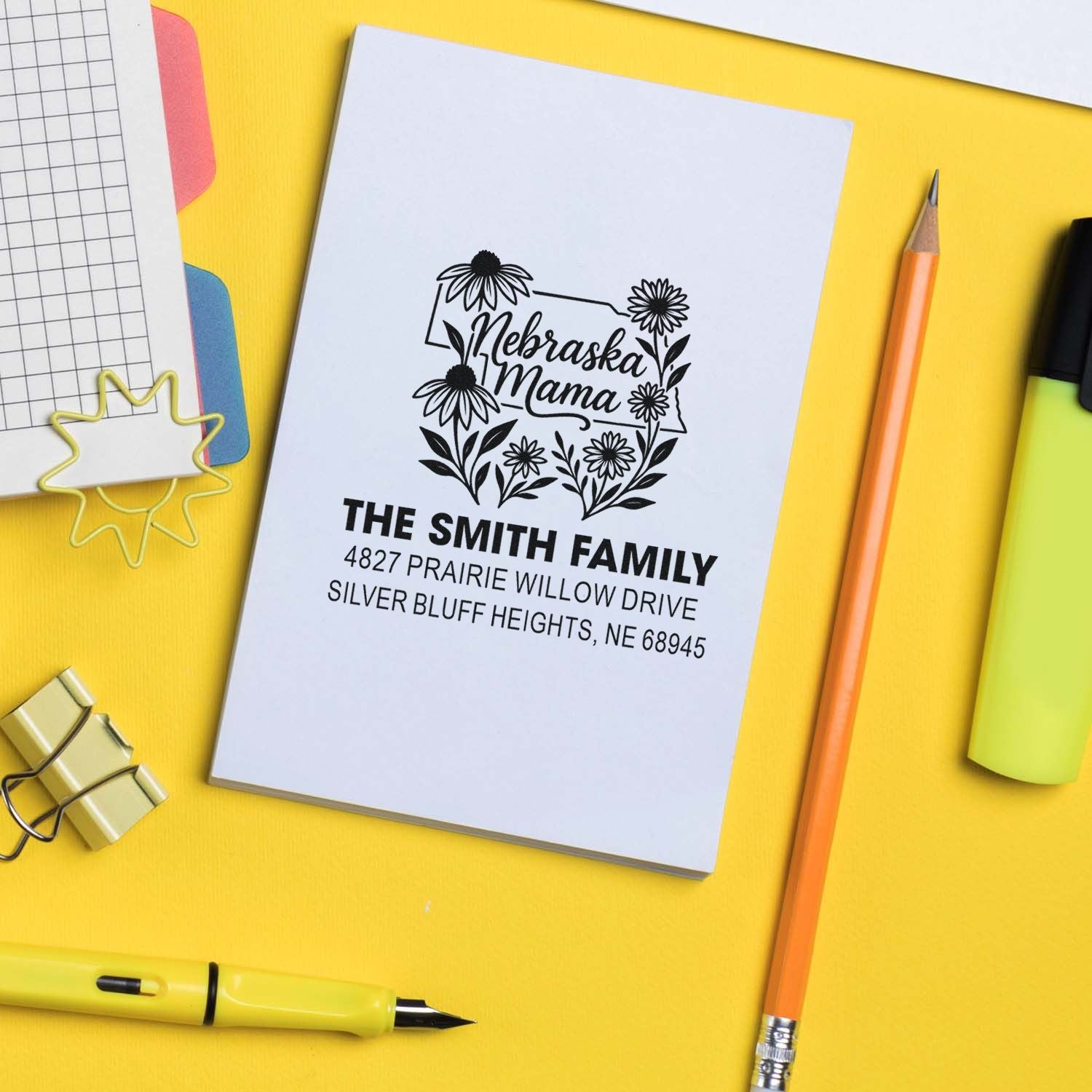 Custom Nebraska Mama rubber stamp with floral state design and The Smith Family return address.