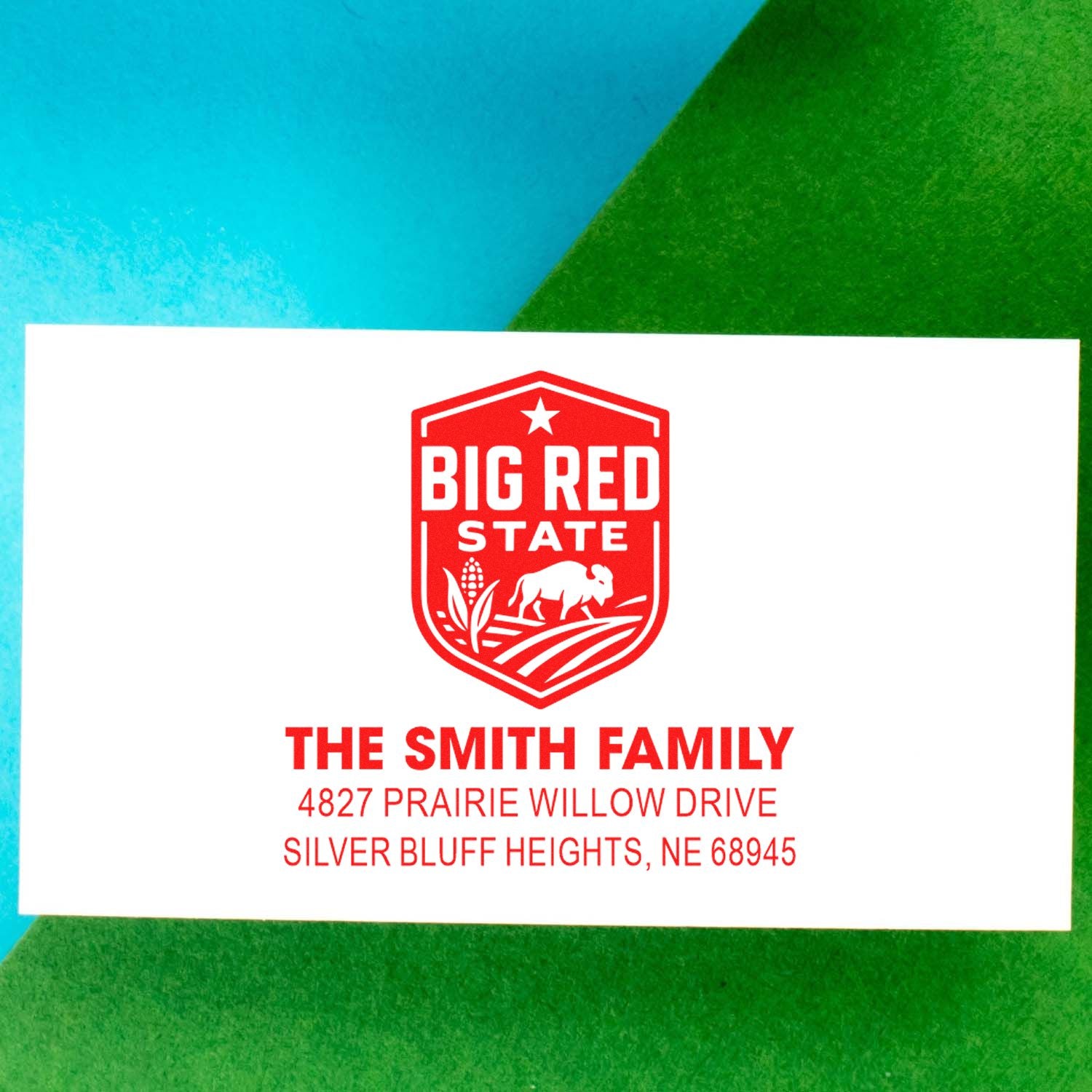 Custom return address rubber stamp for The Smith Family with Big Red State logo and Nebraska address.