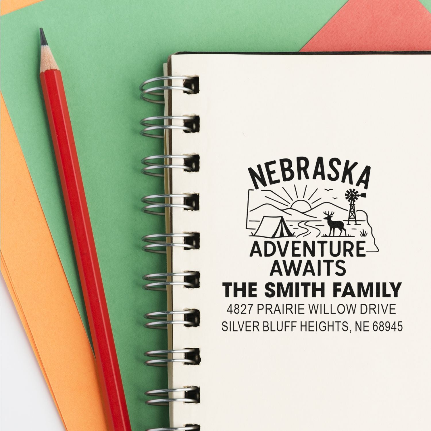 Custom Nebraska rubber stamp with family name and address, featuring adventure graphic for personalized mail and travel gifting.