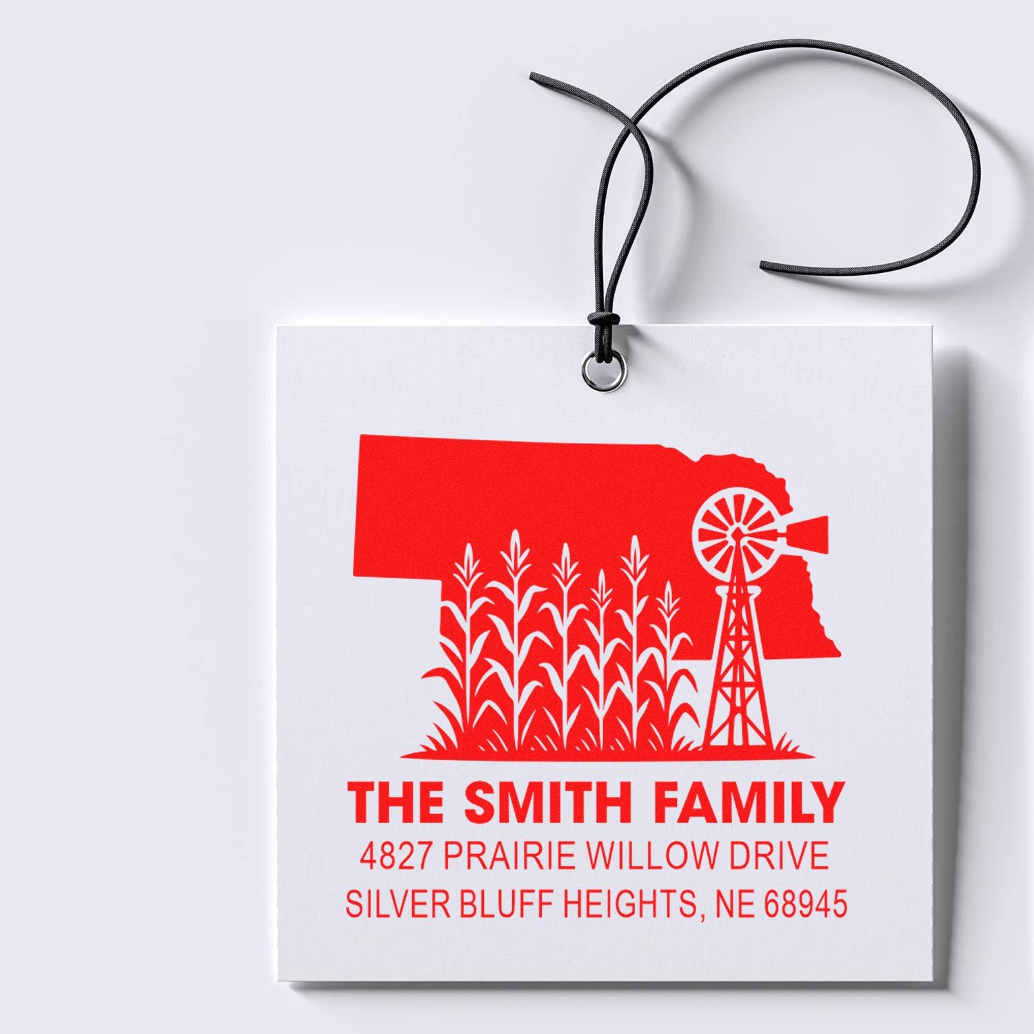 Custom Nebraska farm address rubber stamp with family name and return address for personalized mailings.