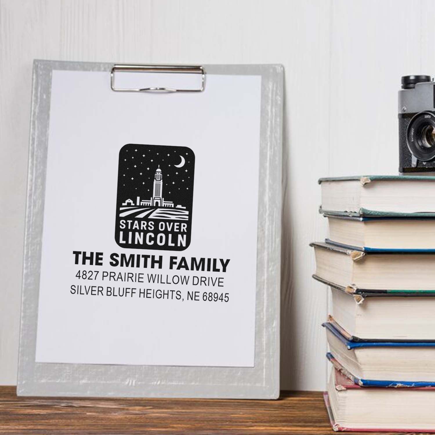 Custom return address rubber stamp with Stars Over Lincoln design, family name, and address for personalized mail.