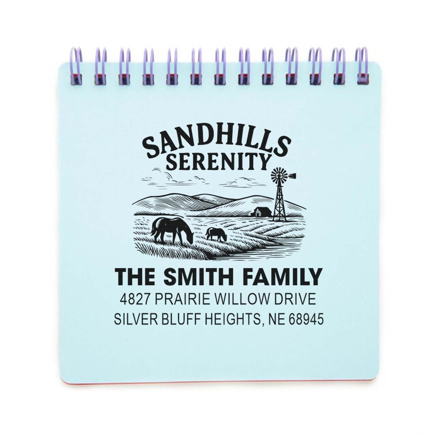 Custom rubber address stamp with prairie scene, family name, and address for personalized return mail.
