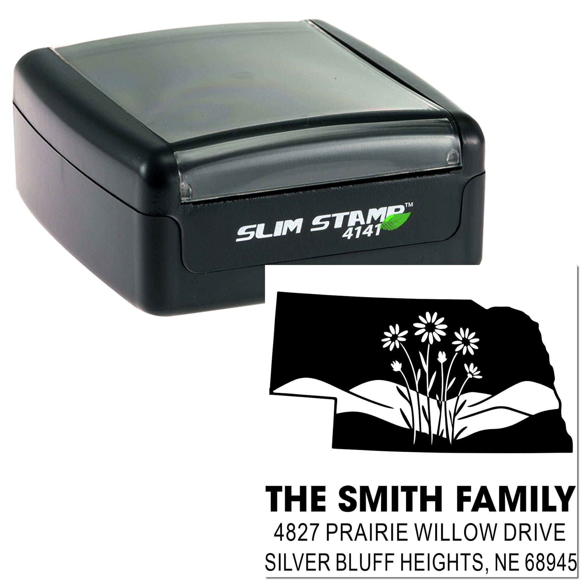 Custom self-inking rubber return address stamp with family name, Nebraska address, and floral landscape design for mailing.
