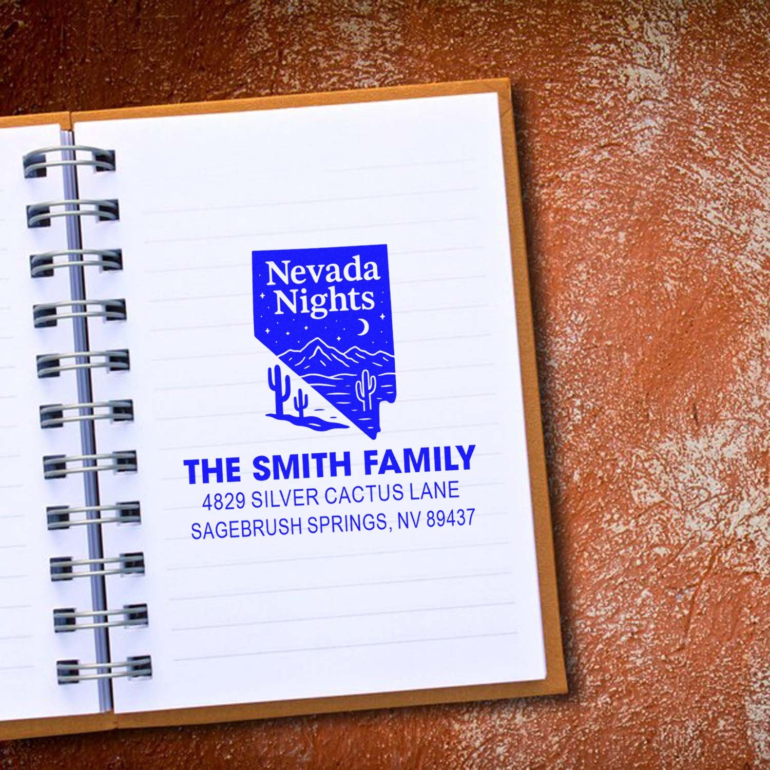 Custom Nevada return address rubber stamp with family name and address, featuring a Nevada Nights desert design.