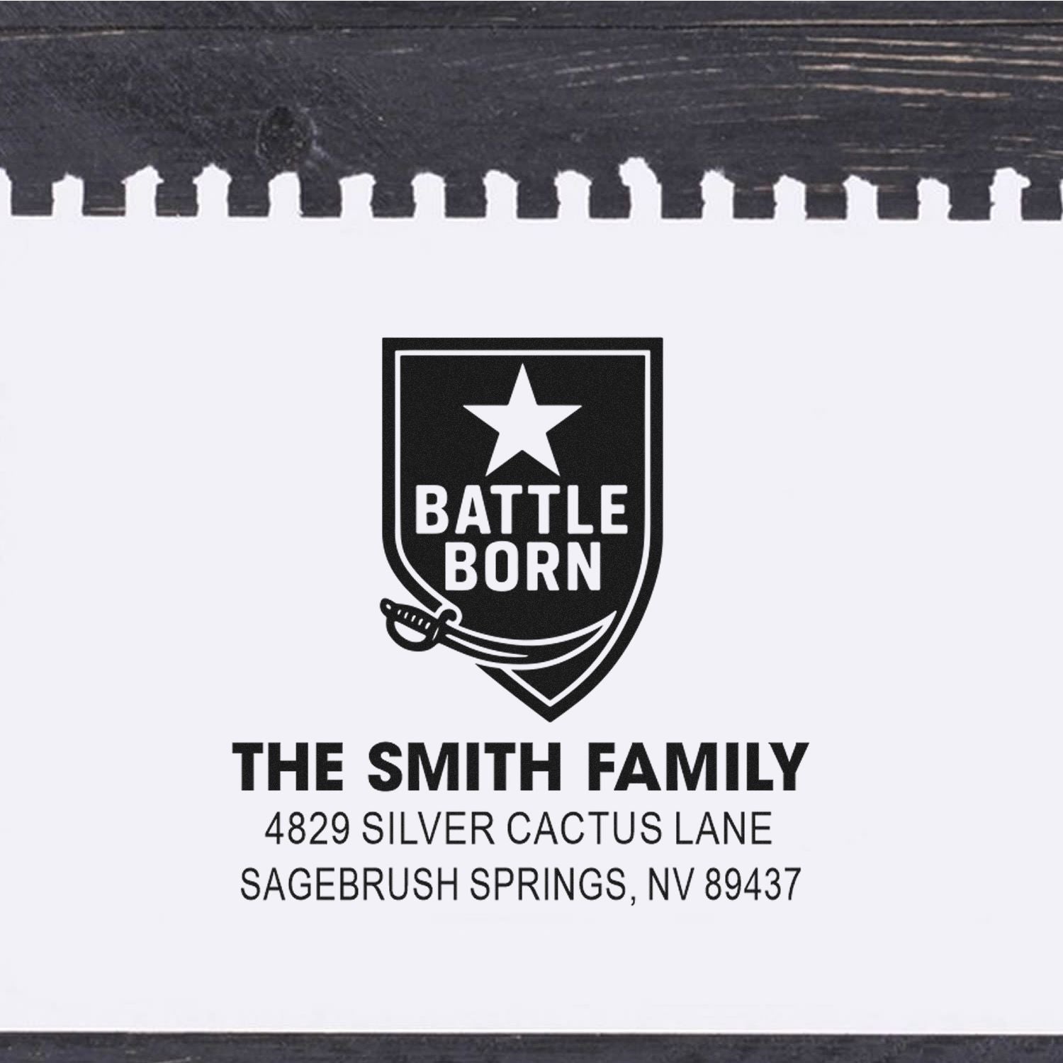 Custom Battle Born family address rubber stamp with sword shield design and The Smith Family, Sagebrush Springs, NV.