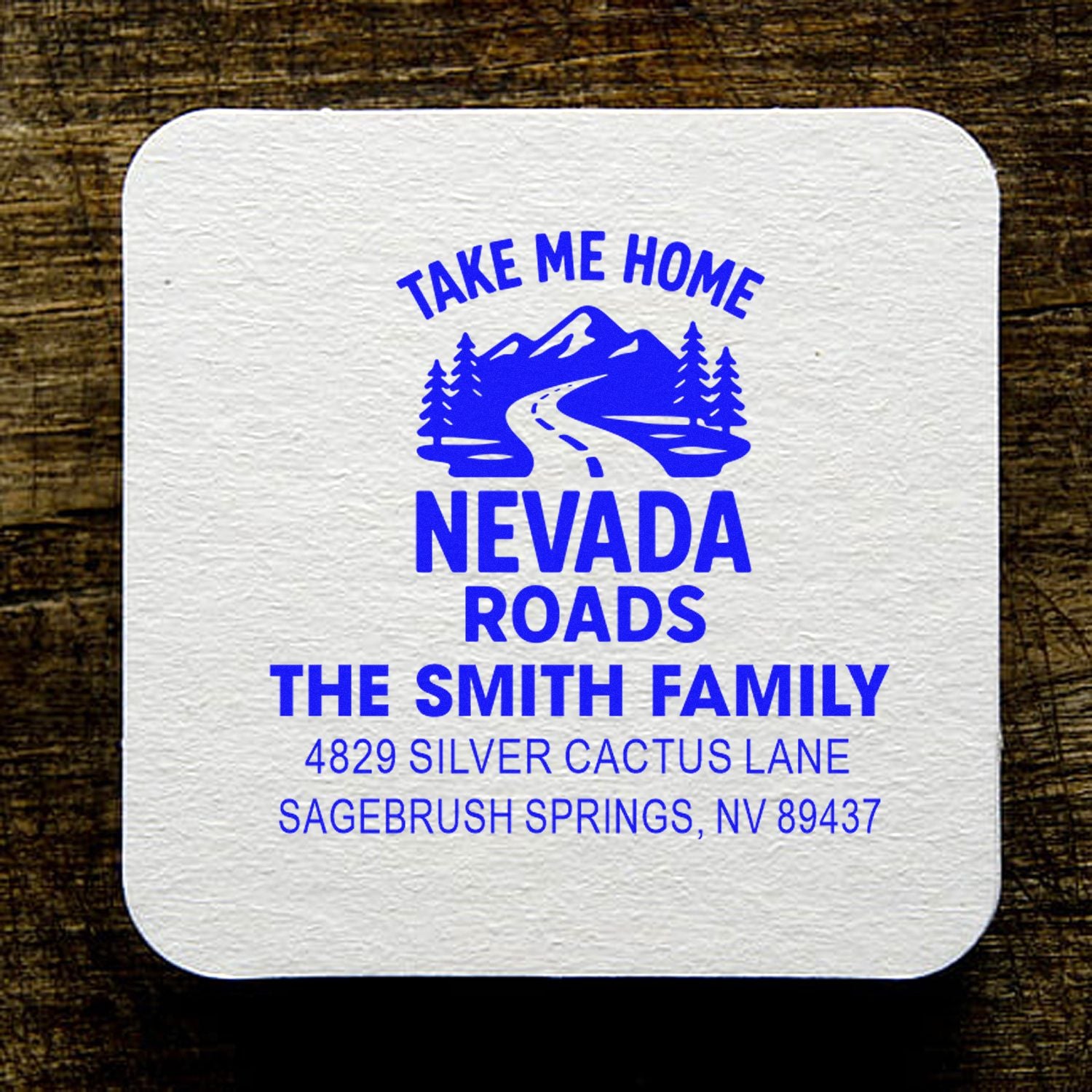 Custom Nevada Roads address rubber stamp for The Smith Family, with mountain road design and full mailing address.