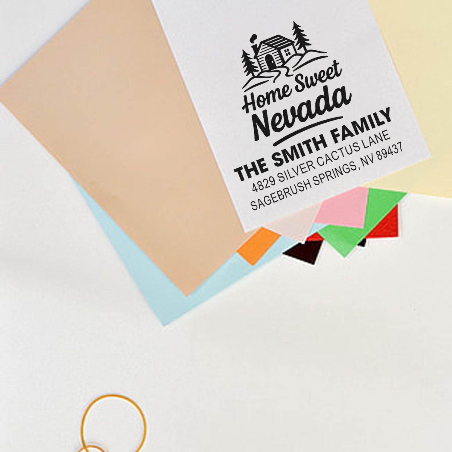 Custom return address stamp with Home Sweet Nevada design, family name, and address for personalized mail.