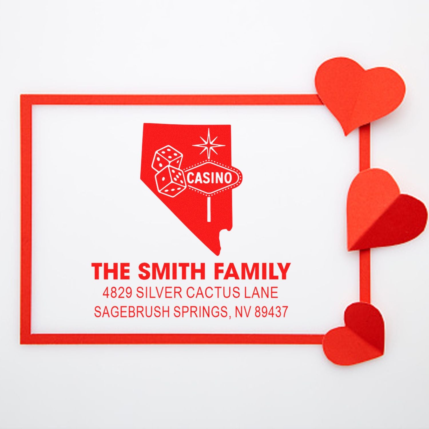 Custom casino-themed return address rubber stamp with family name, Nevada design, and heart accents.