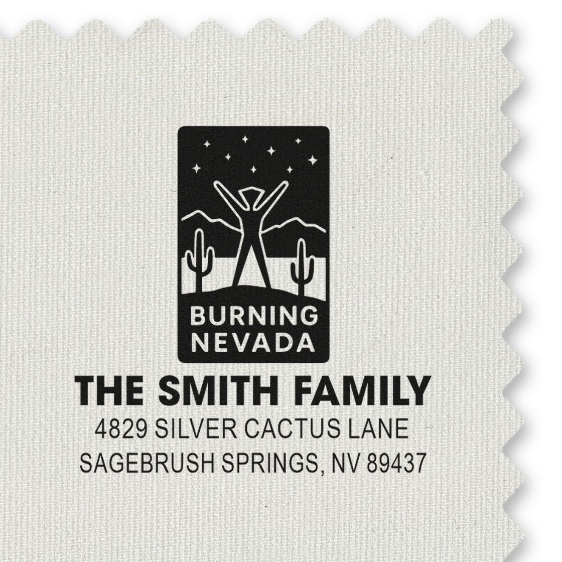 Custom family return address rubber stamp with Burning Nevada logo and Sagebrush Springs, NV address.