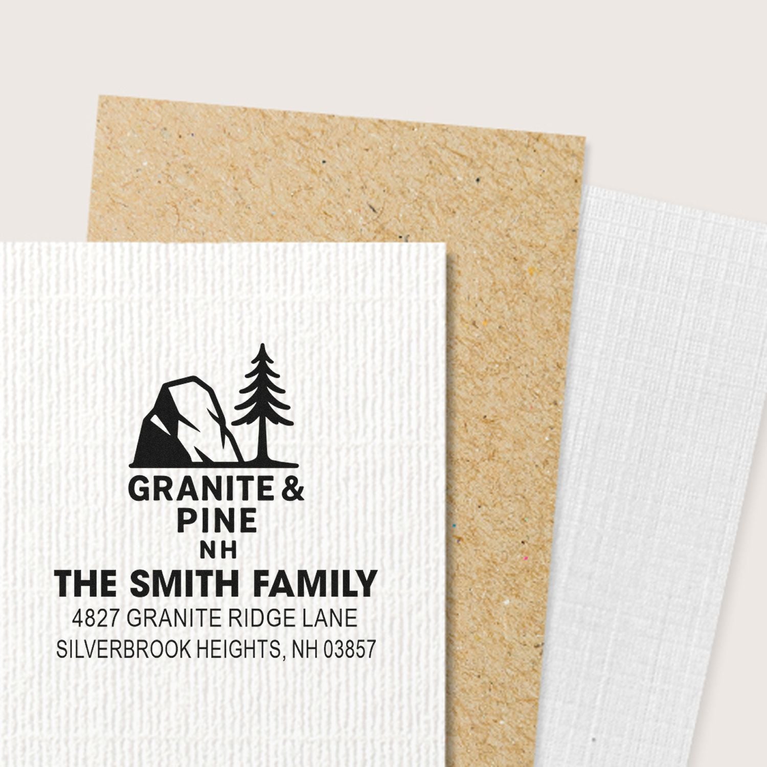Custom return address rubber stamp with Granite & Pine NH logo for The Smith Family, Silverbrook Heights, NH.