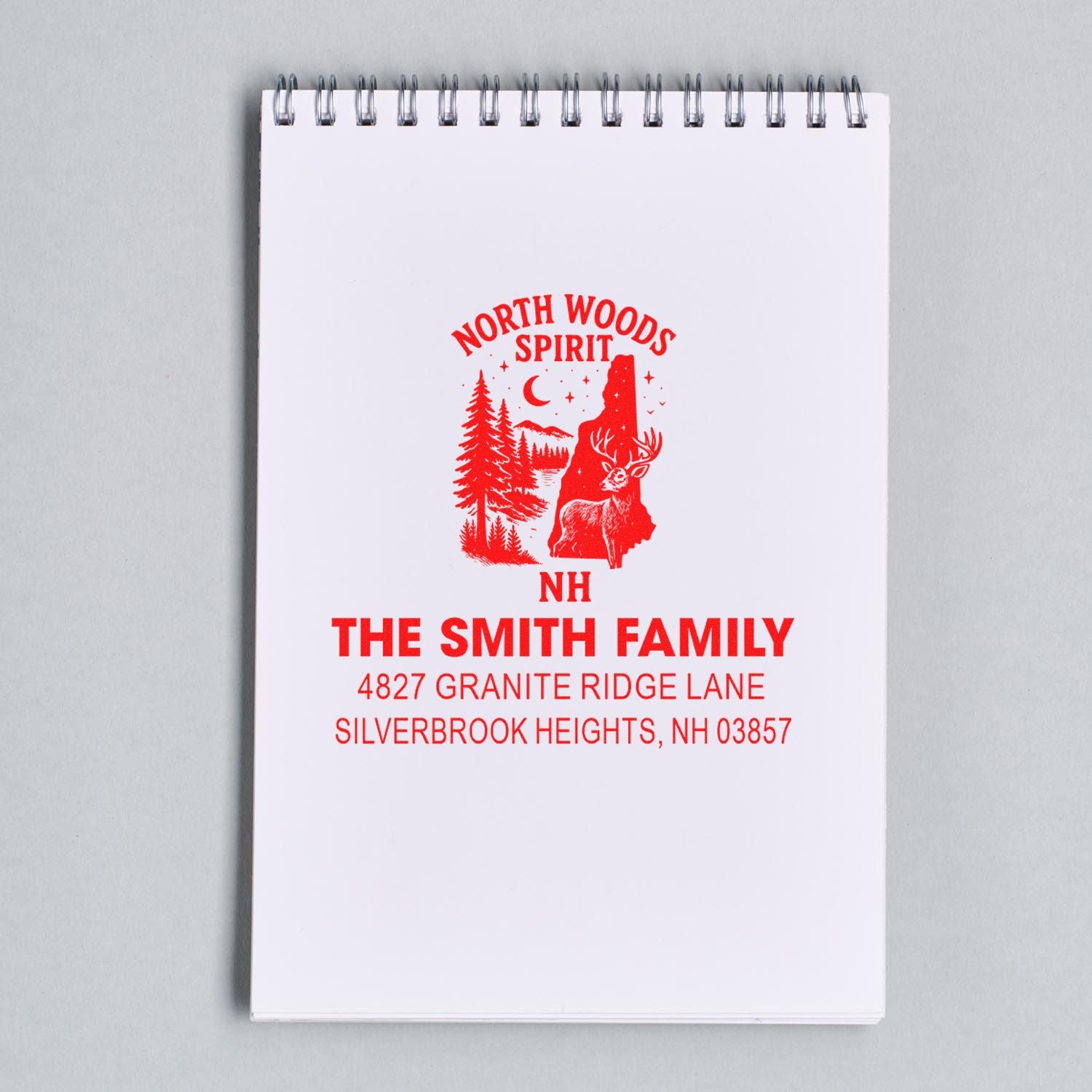 Custom rubber address stamp with North Woods Spirit deer design, featuring The Smith Family and Silverbrook Heights, NH address.