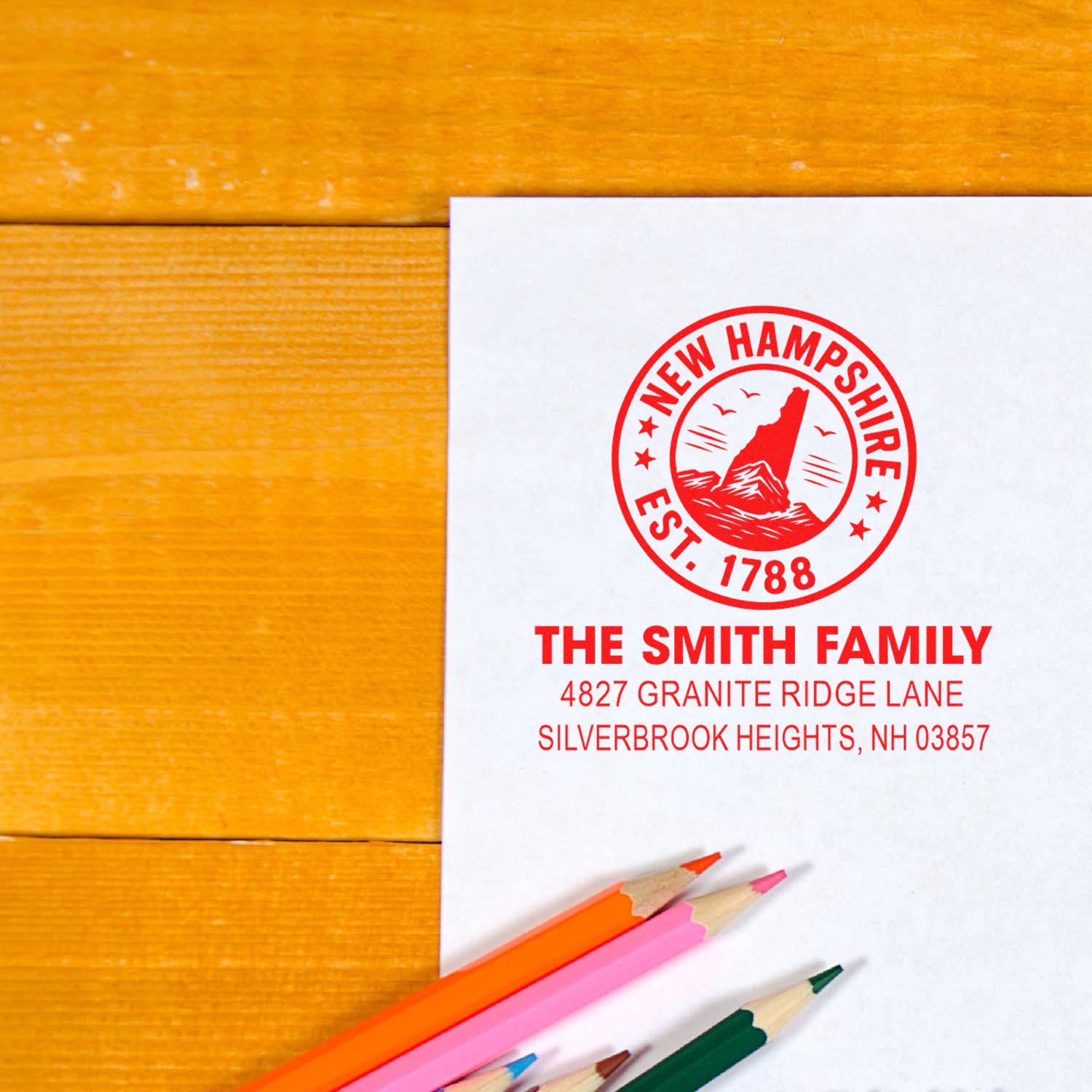 Custom family return address rubber stamp with New Hampshire seal design, ideal for personalized stationery and mailing.