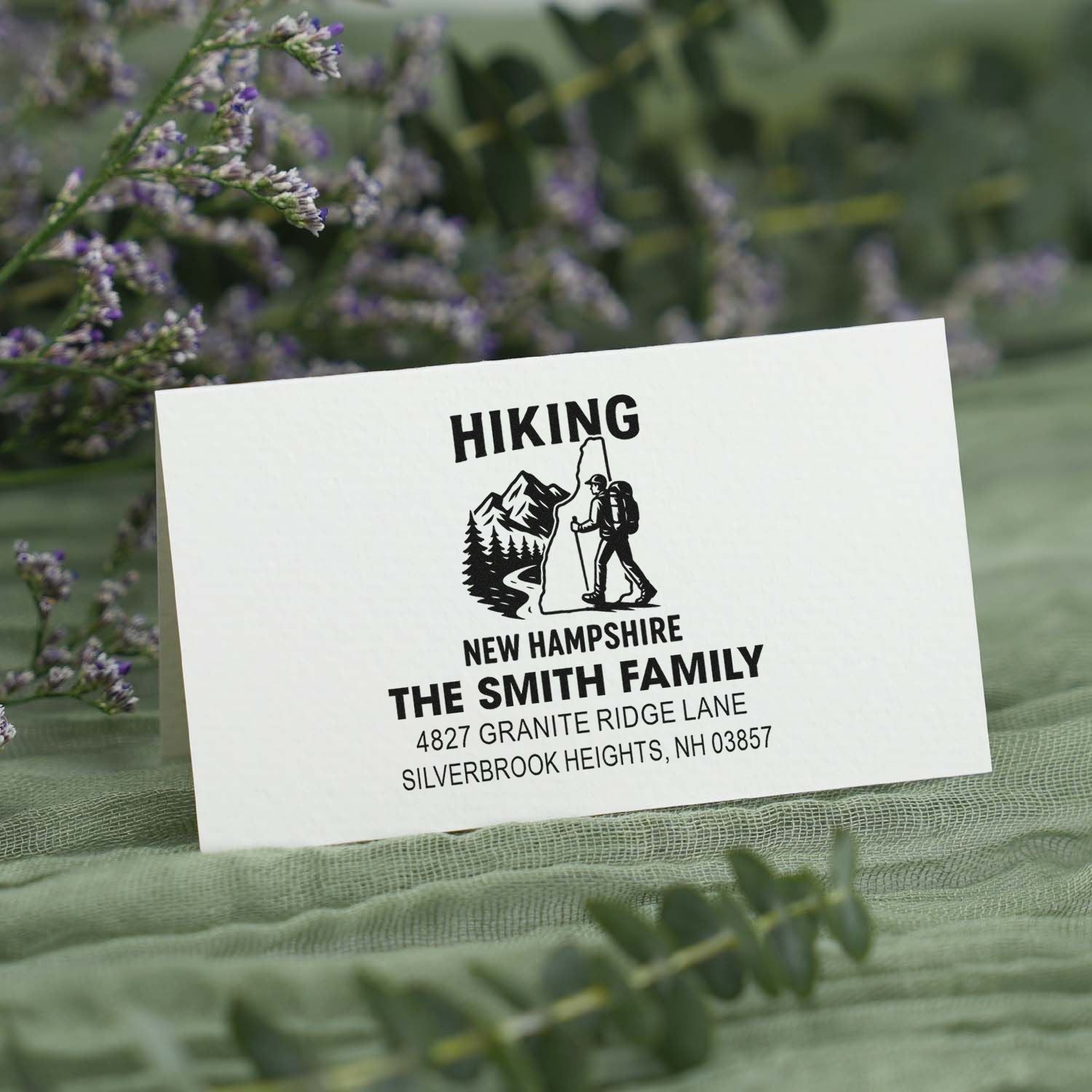 Custom hiking rubber stamp with mountain hiker design and personalized family return address for New Hampshire mailings.