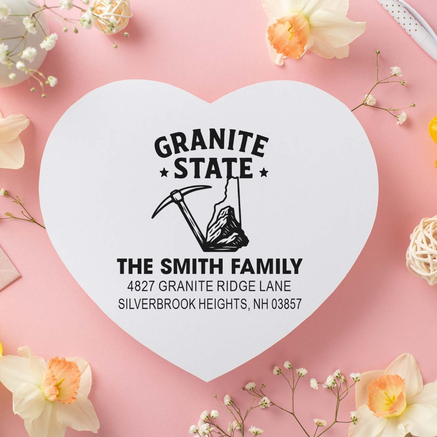 Custom heart-shaped rubber return address stamp for the Smith family with Granite State design and pickaxe icon.