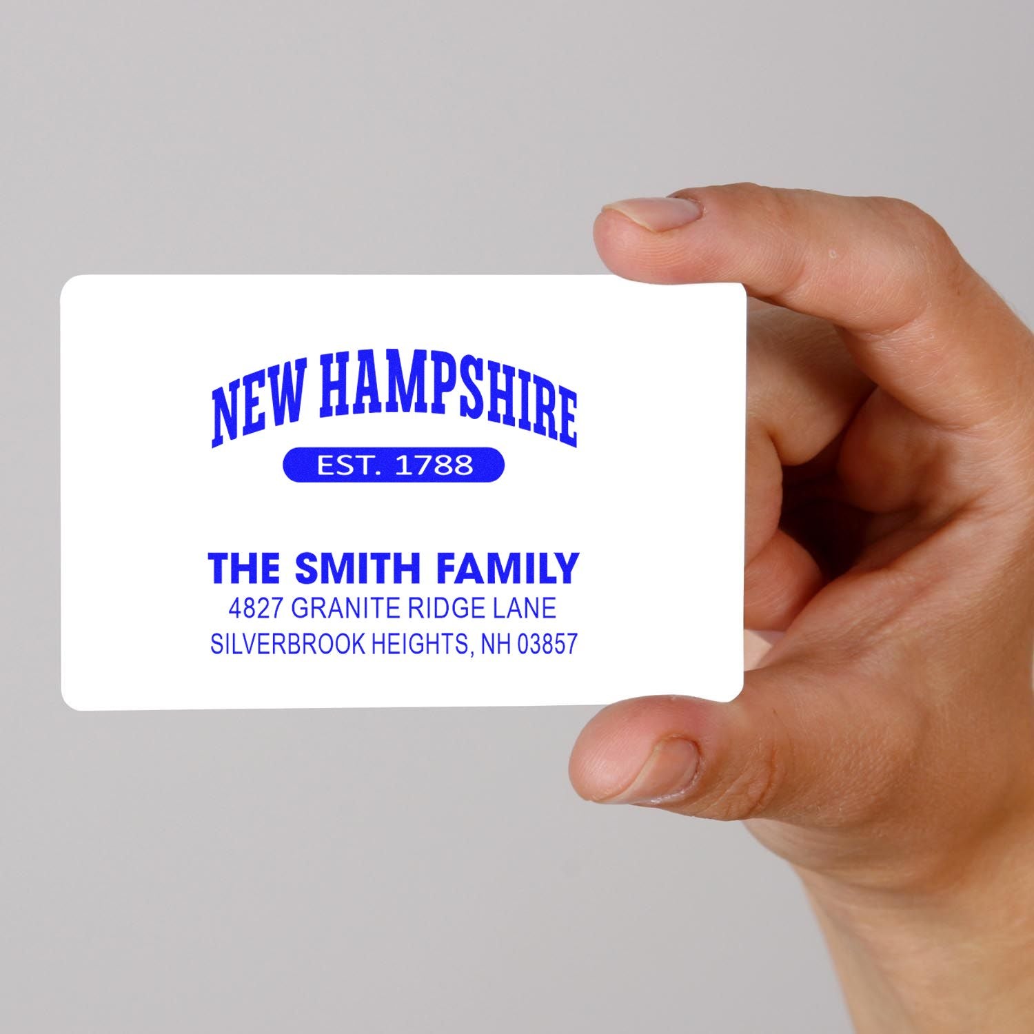 Custom family return address rubber stamp with New Hampshire design and Smith family address details.