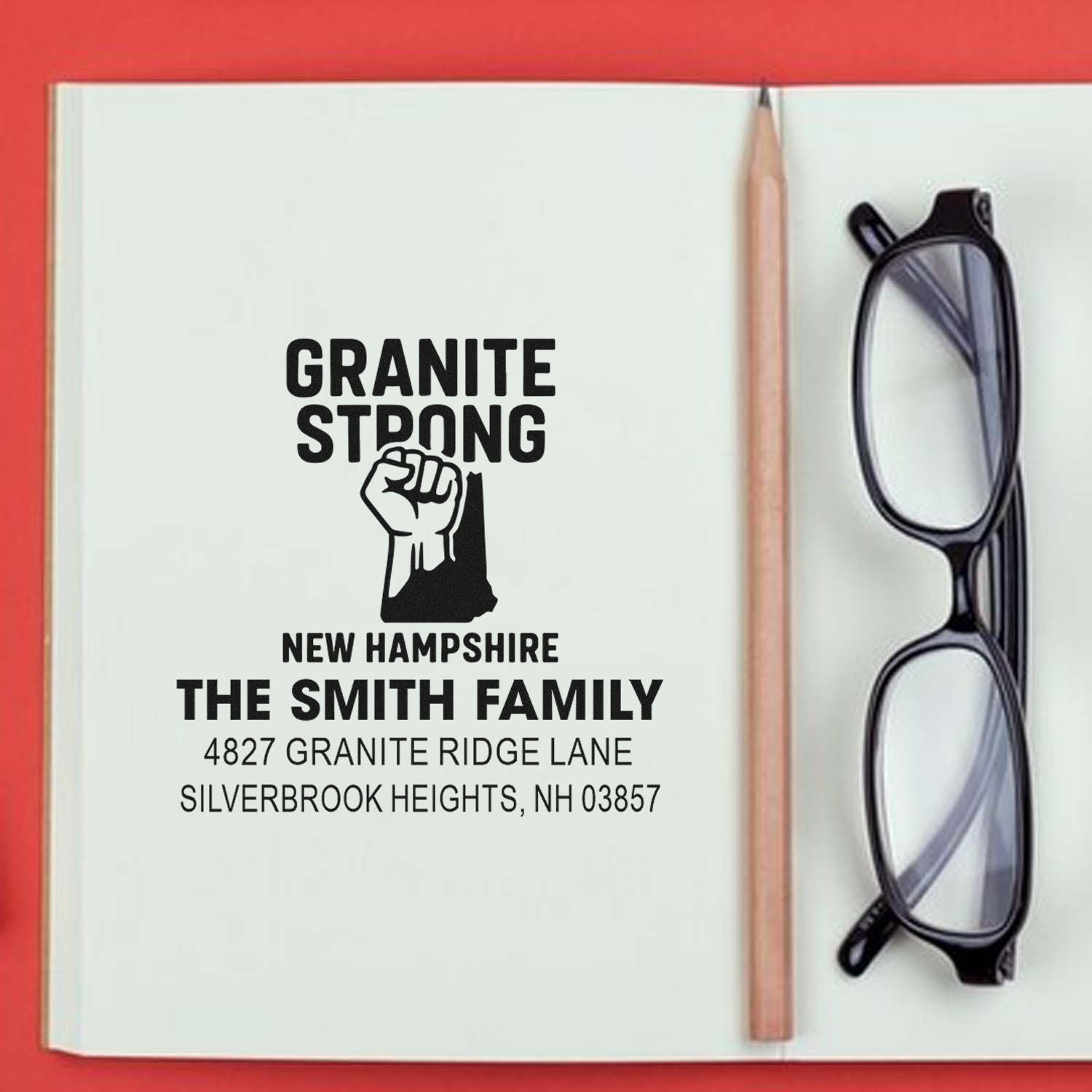 Personalized Granite Strong New Hampshire rubber address stamp for The Smith Family with custom home address.