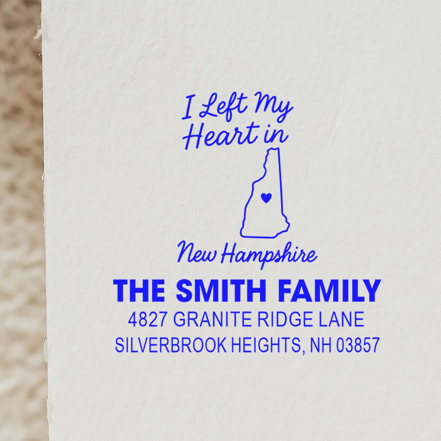 Custom rubber stamp with I Left My Heart in New Hampshire design and personalized family return address for mailings.
