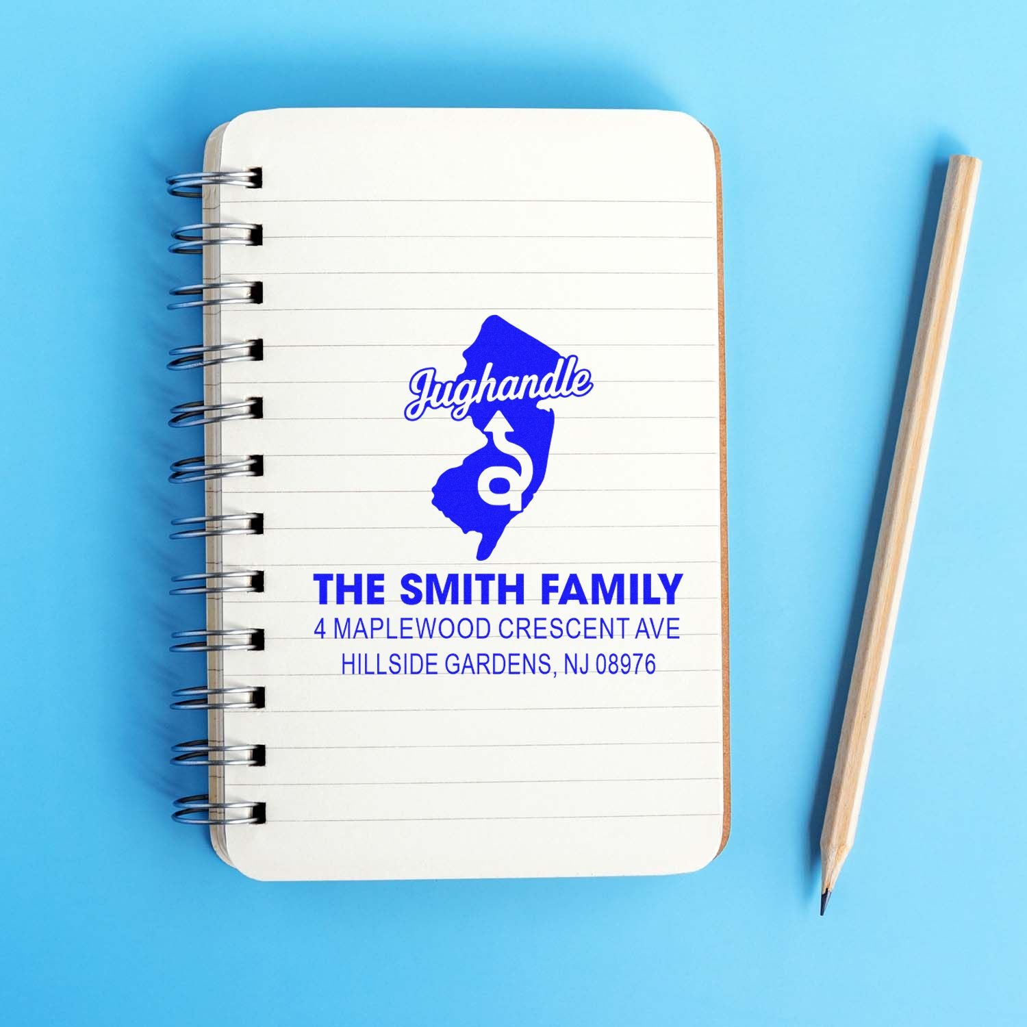 Personalized return address rubber stamp imprint on notebook, featuring The Smith Family and New Jersey state design.