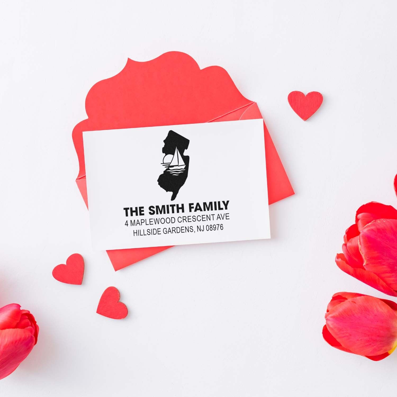 Custom return address rubber stamp for The Smith Family, with New Jersey address and sailboat logo for personalized stationery.