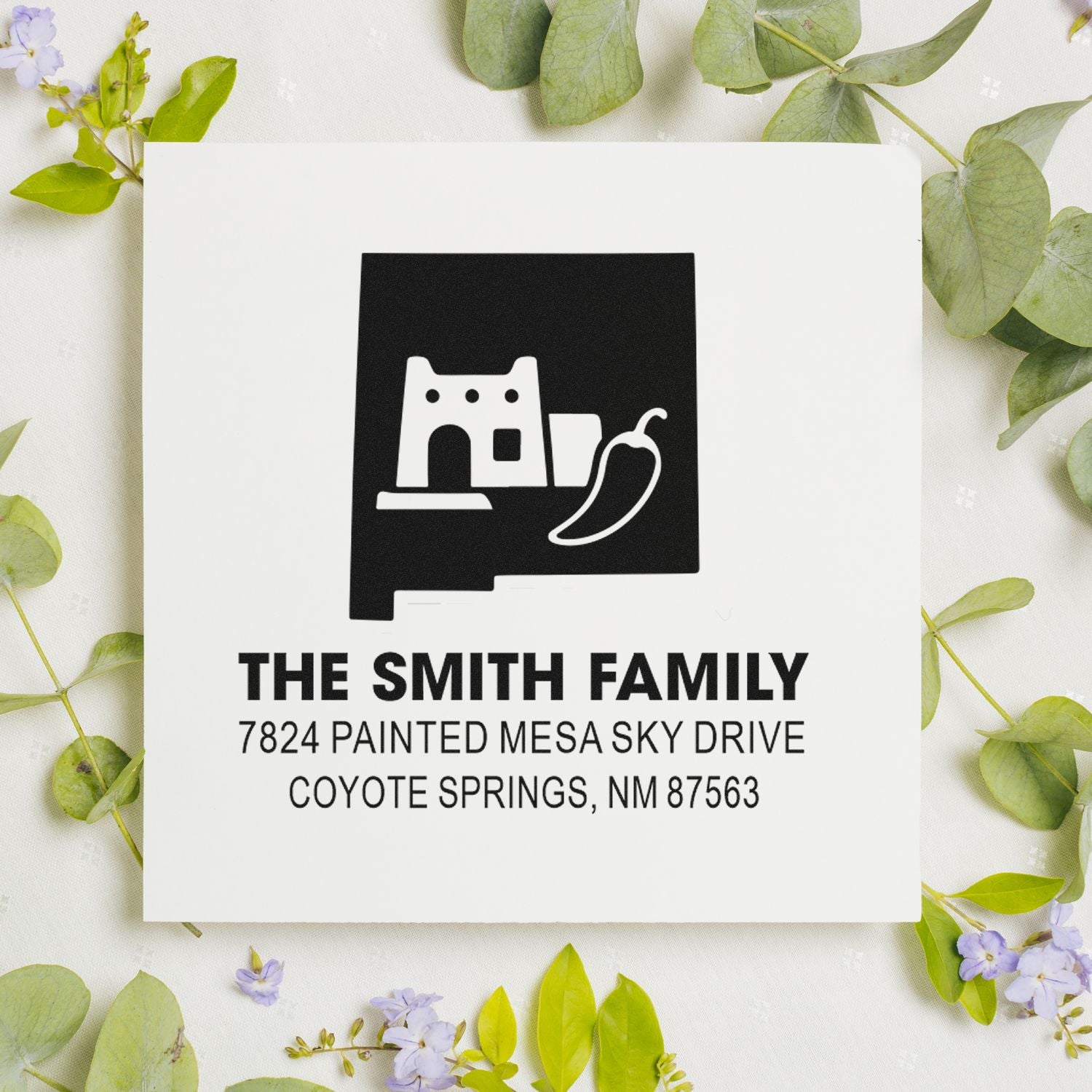 Personalized address rubber stamp for The Smith Family, Coyote Springs, NM with New Mexico home design.