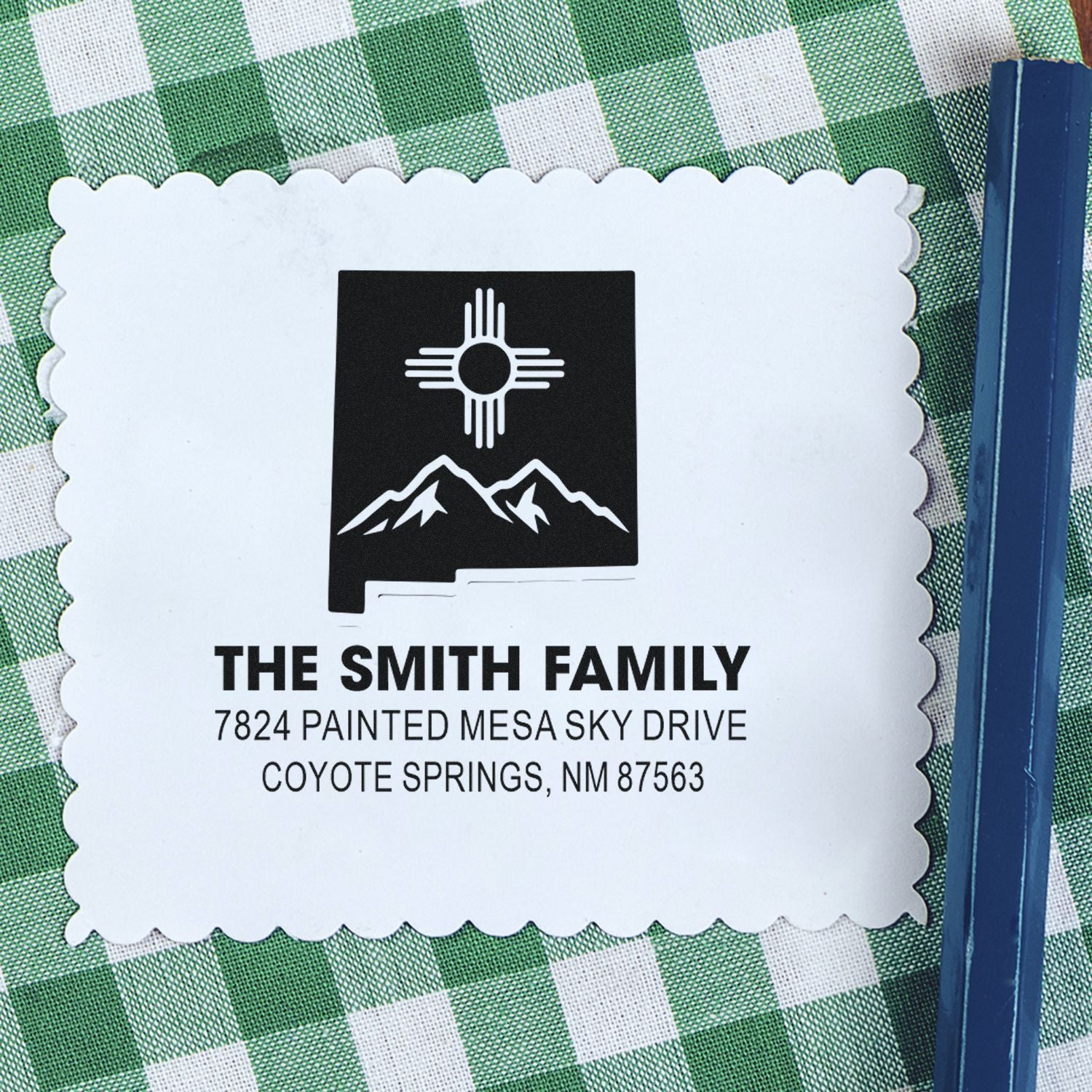 Custom return address rubber stamp for The Smith Family with Southwest mountain logo and Coyote Springs, NM address.