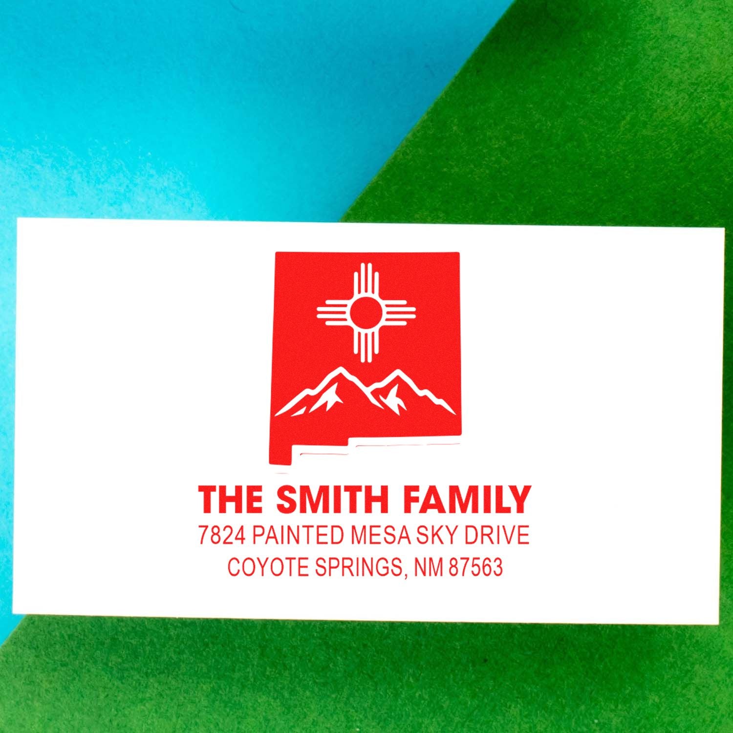 Personalized family address rubber stamp with Zia sun and mountain design for The Smith Family in Coyote Springs, New Mexico.