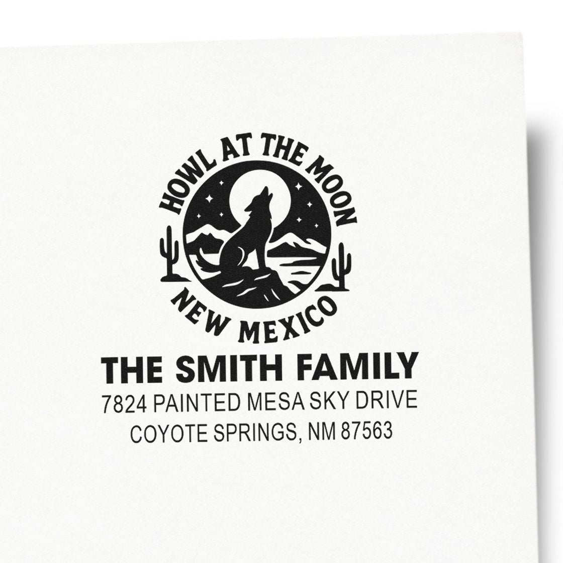 Custom return address rubber stamp with howl at the moon New Mexico wolf design for The Smith Family, Coyote Springs, NM.