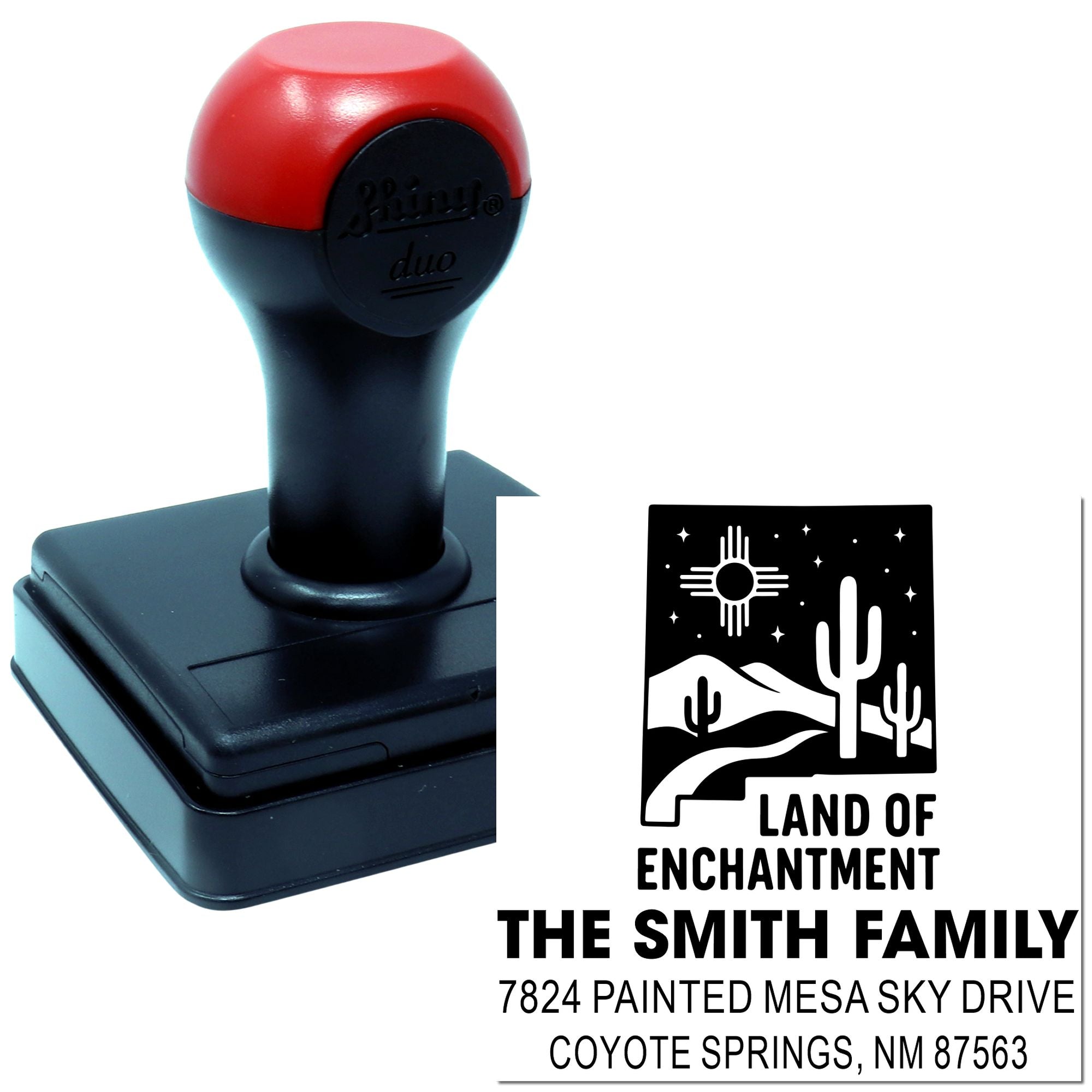 Custom self-inking rubber return address stamp for The Smith Family with Land of Enchantment desert design.