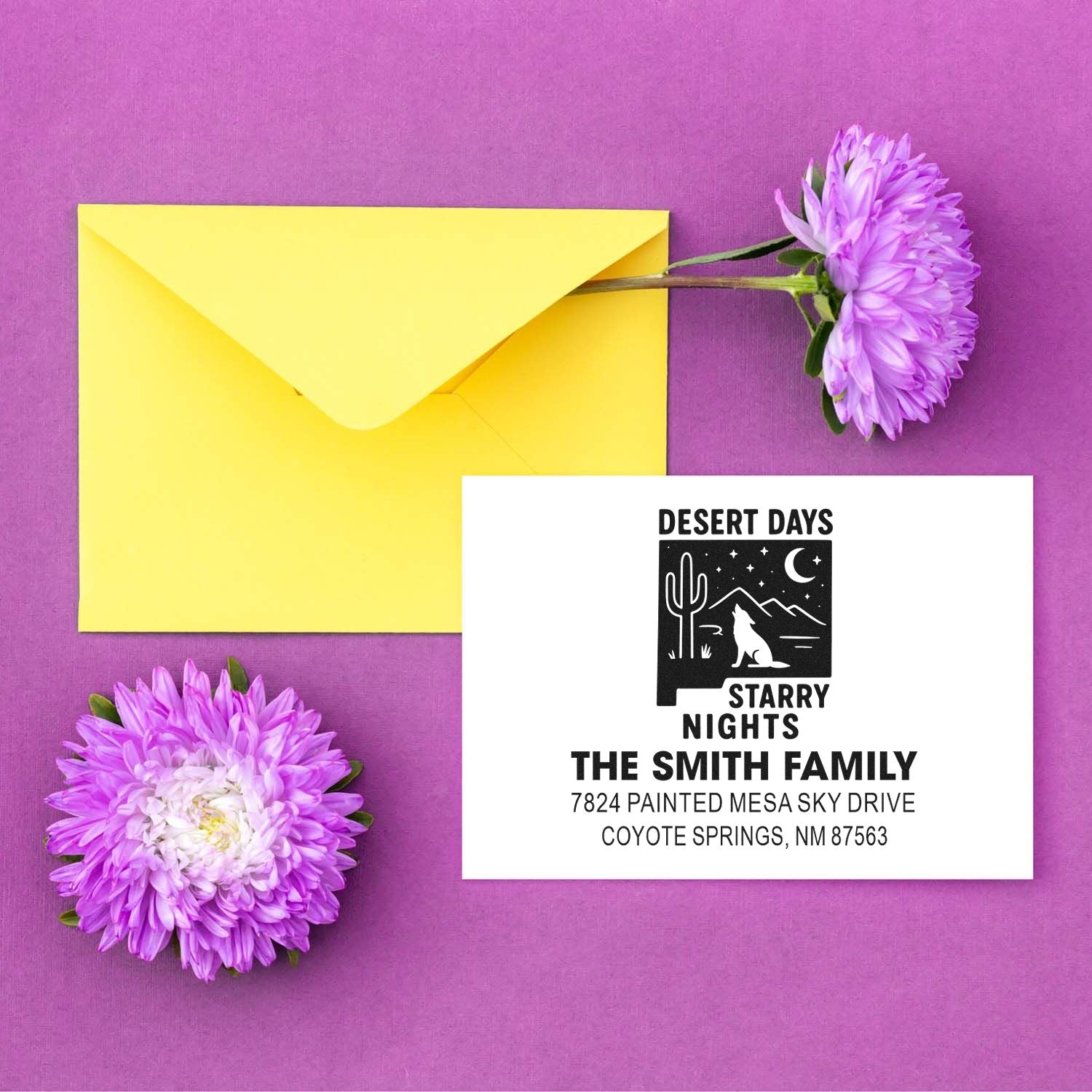 Custom rubber return address stamp for The Smith Family, featuring a desert nights design, with envelope and flowers.