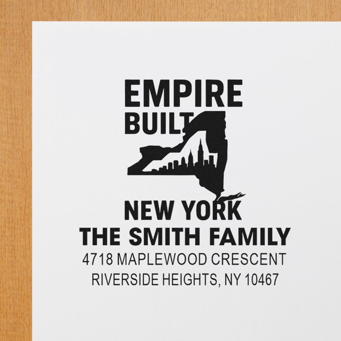 Custom New York family address rubber stamp with Empire State design for The Smith Family, 4718 Maplewood Crescent, Riverside Heights, NY 10467.