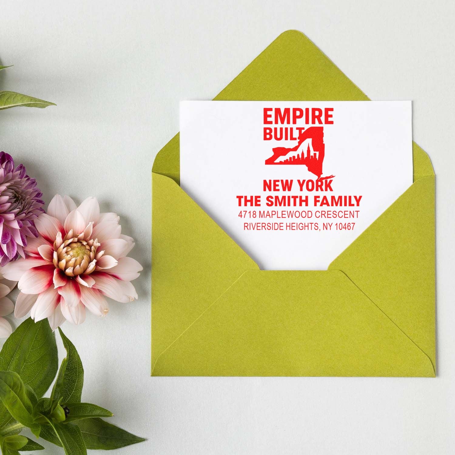 Custom New York return address rubber stamp for The Smith Family, shown on a mailed envelope.