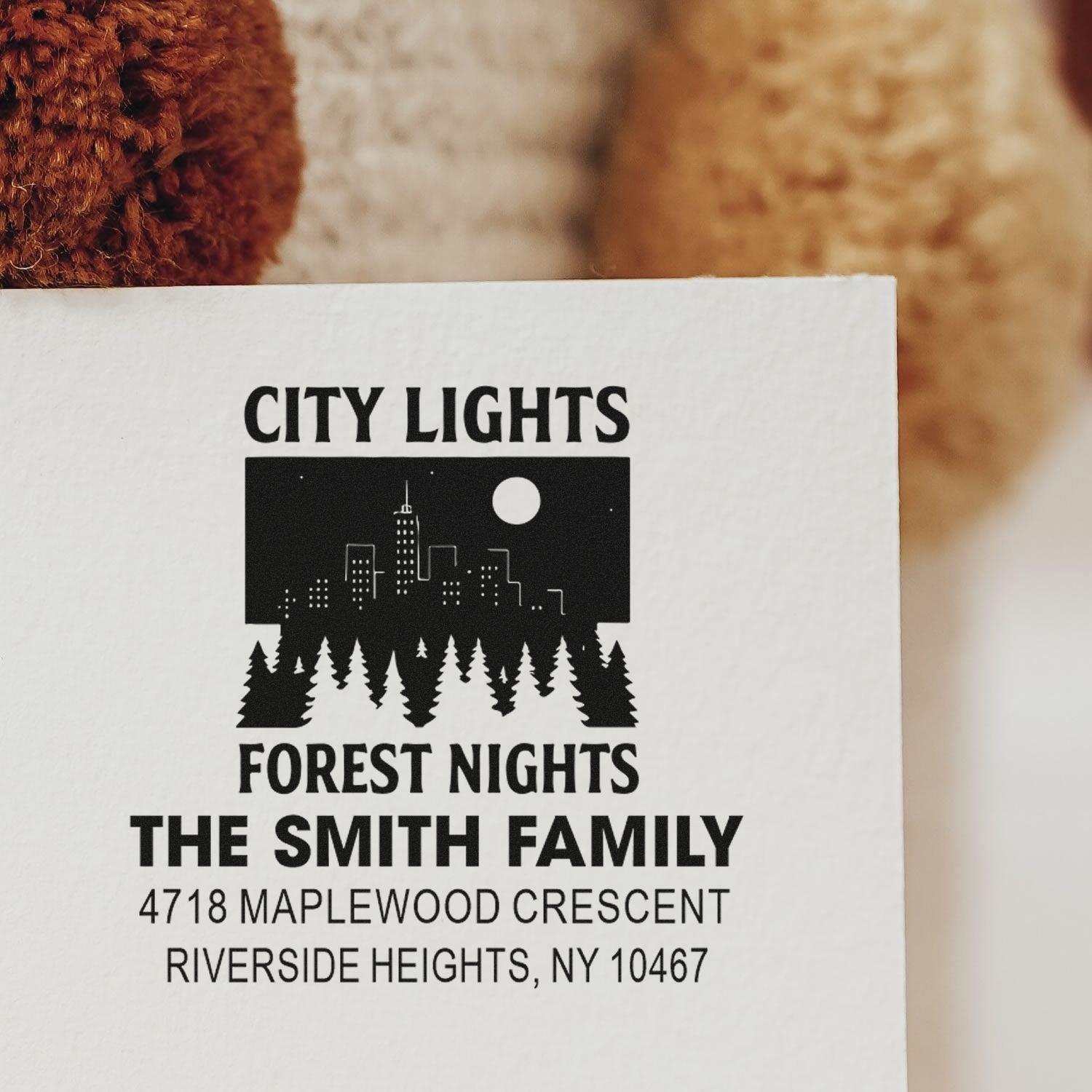 Custom address rubber stamp for The Smith Family with city skyline and forest night design.