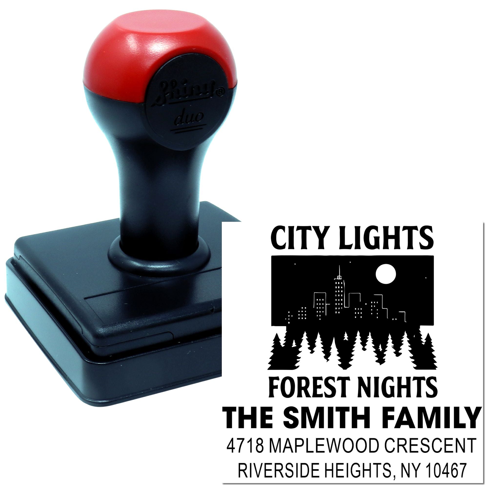 Custom self-inking rubber stamp with city lights forest nights design, family name, and address sample.