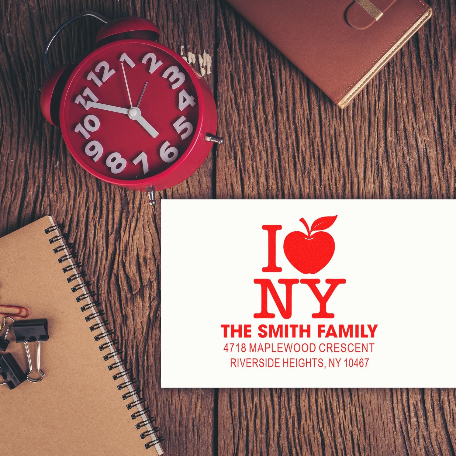 Custom rubber stamp with I Love NY logo, The Smith Family name, and return address for personalized envelopes.