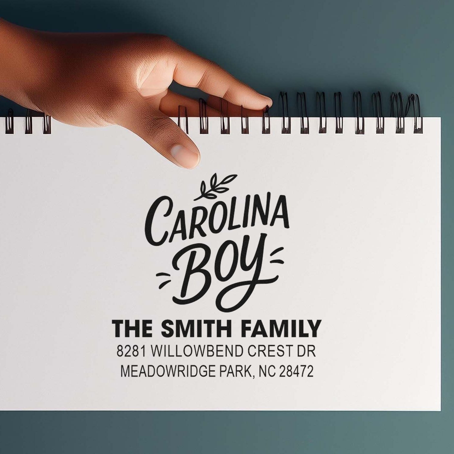 Custom rubber stamp mockup for Carolina Boy family address stamp with name and address
