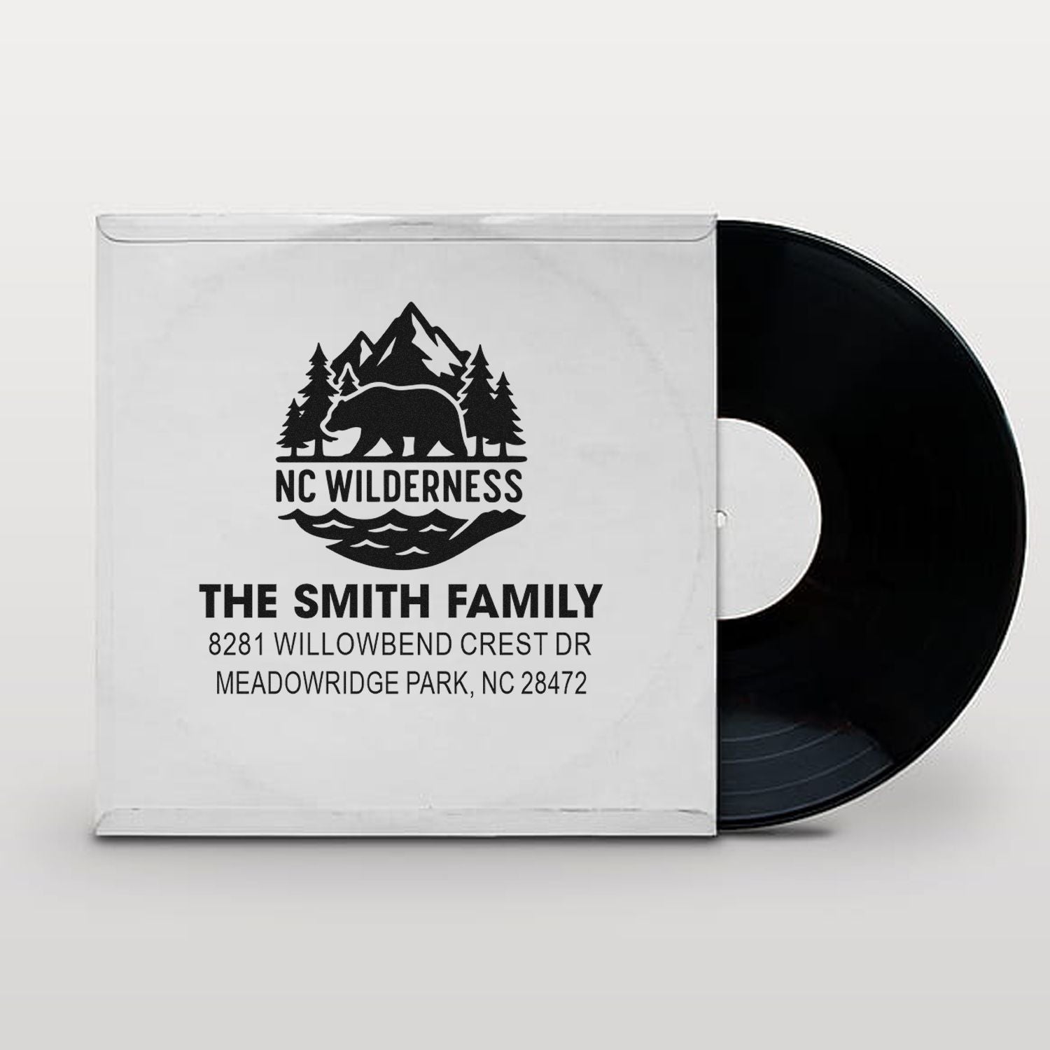 Custom return address rubber stamp with NC Wilderness bear, mountain logo, and Smith family address.