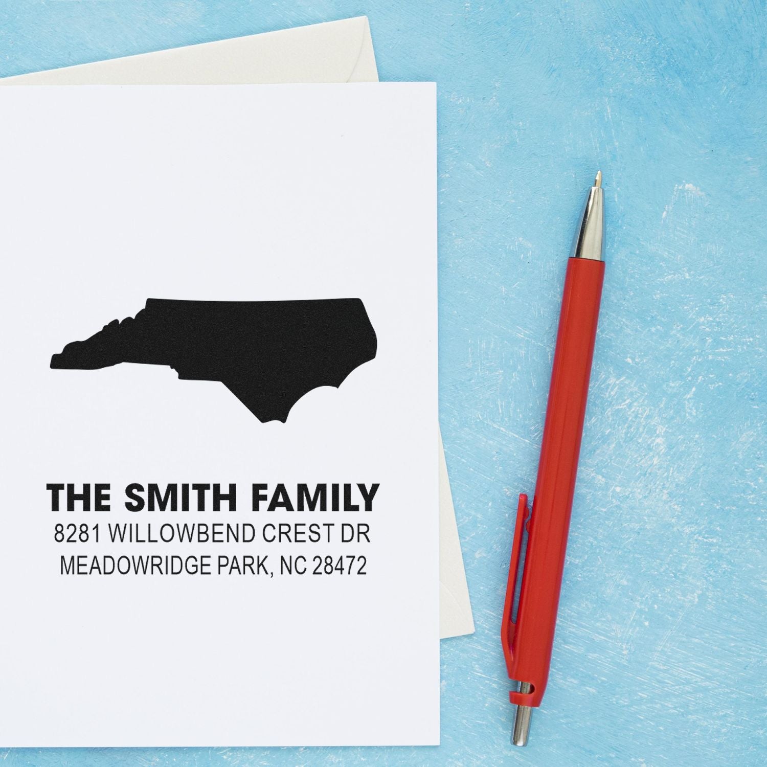 Custom North Carolina return address rubber stamp with personalized family name and address for envelopes.