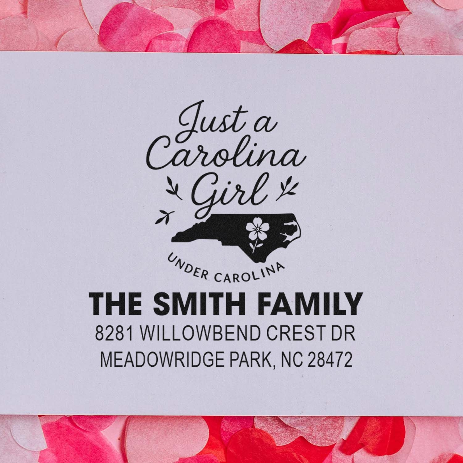 Custom return address rubber stamp with Just a Carolina Girl Under Carolina, The Smith Family, Meadowridge Park, NC 28472.